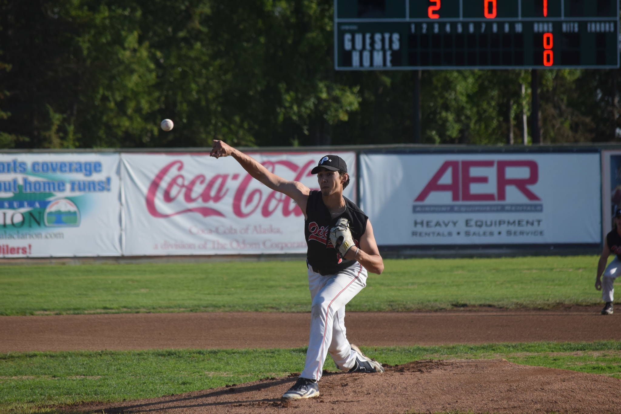 Oilers pitcher Liam Rocha fires off a pitch during the team’s home game against the Chugiak Chinooks on July 13, 2021, at Coral Seymour Memorial Ball Park in Kenai, Alaska. (Camille Botello / Peninsula Clarion)