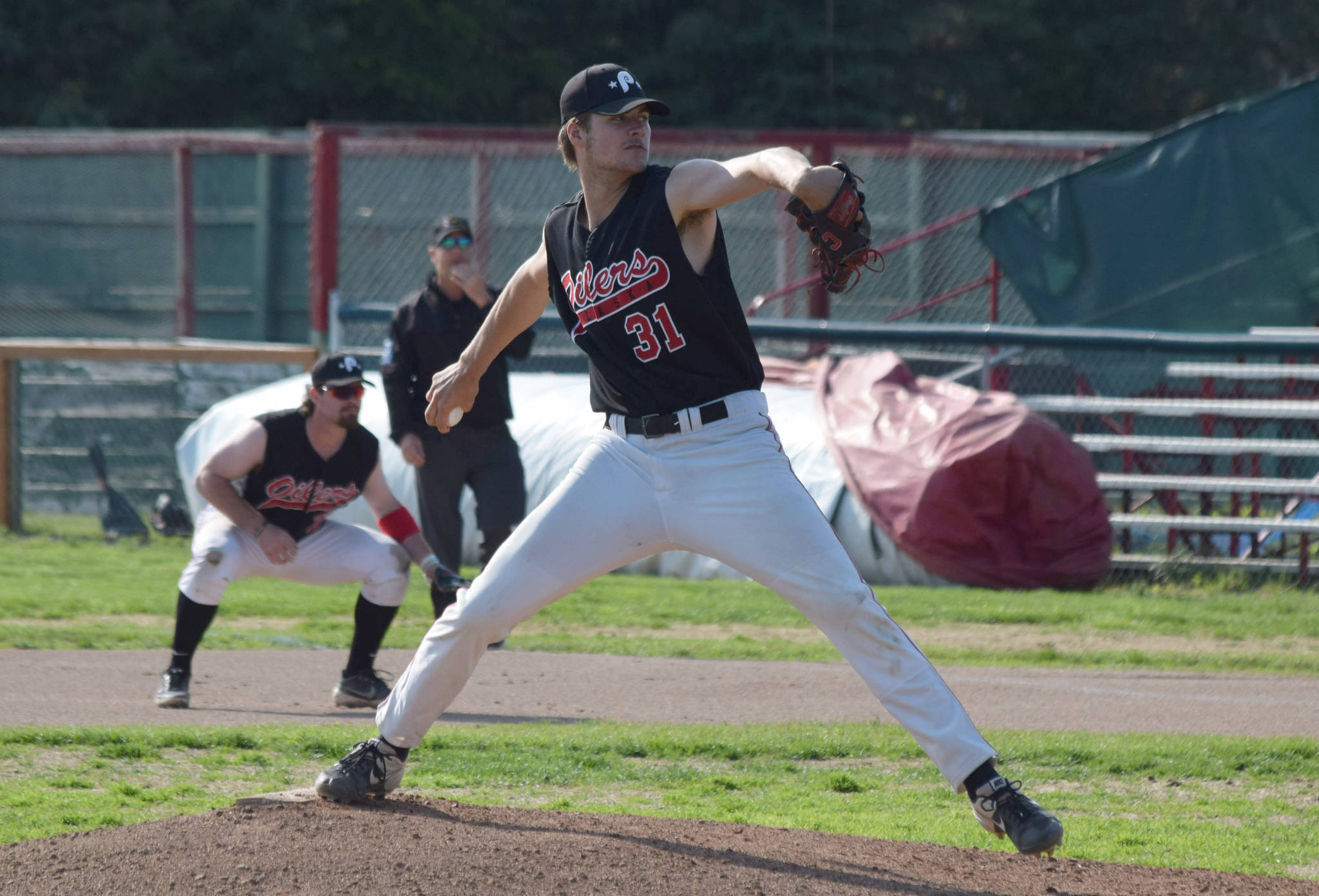 Oilers starting pitcher Luke Yacinich delivers home during the team’s home game against the Chugiak Chinooks at Coral Seymour Memorial Park in Kenai, Alaska, on Wednesday, July 14, 2021. (Camille Botello / Peninsula Clarion)