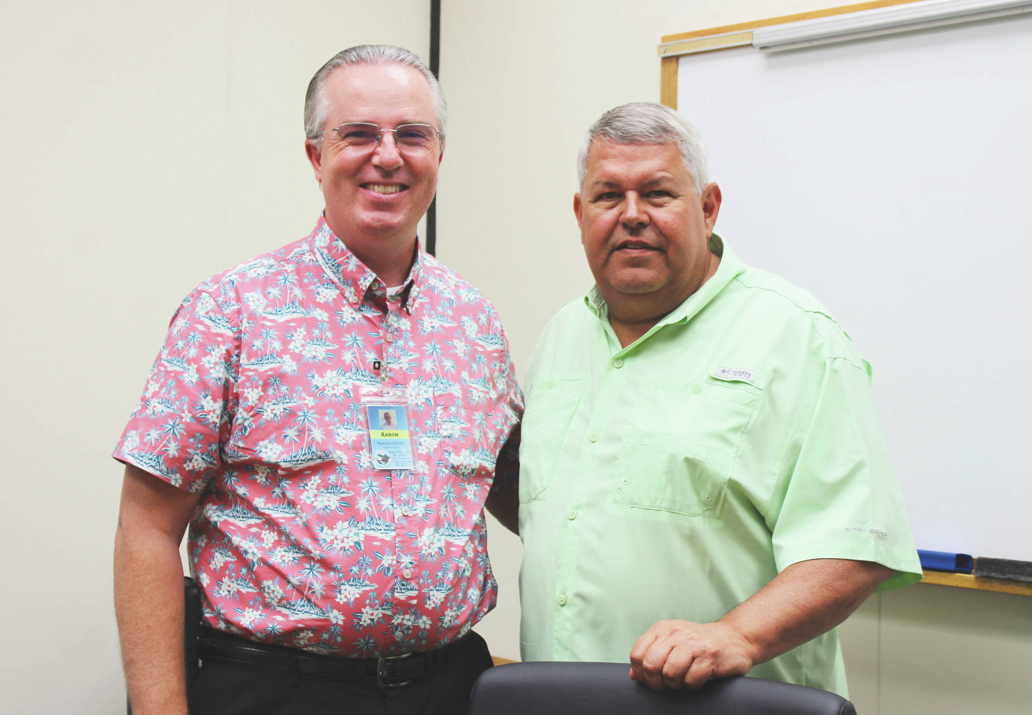 Ashlyn O’Hara / Peninsula Clarion 
Aaron Rhoades (left) and Charlie Pierce stand in a conference room in the George A. Navarre Borough Administration Building on Tuesday in Soldotna.
