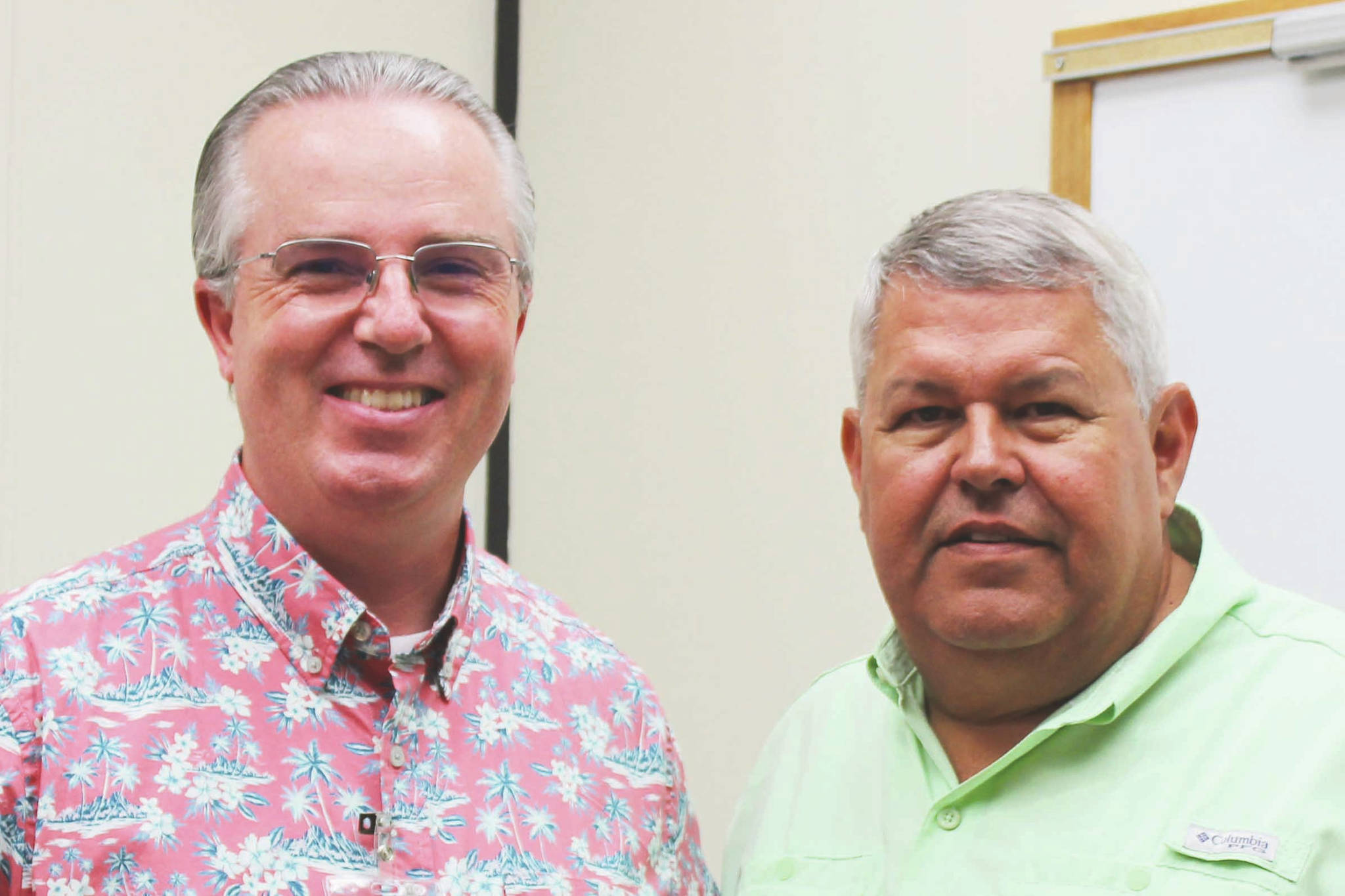 Aaron Rhoades and Charlie Pierce stand in a conference room in the George A. Navarre Borough Administration Building on Tuesday, July 20, 2021, in Soldotna, Alaska. (Ashlyn O'Hara/Peninsula Clarion)