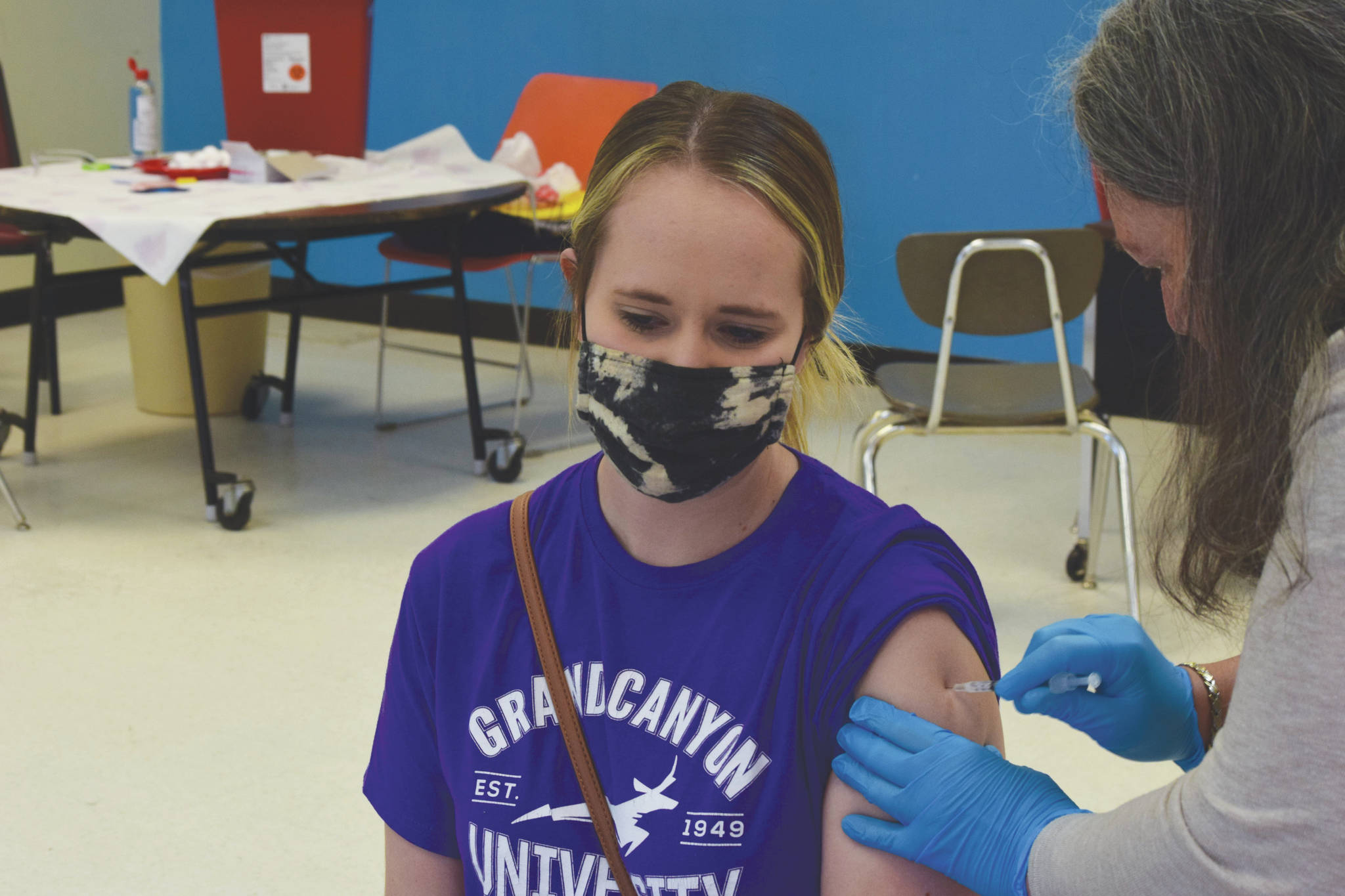 Soldotna resident Leah McCabe receives her first dose of the Pfizer-BioNTech COVID-19 vaccine at the The Soldotna Professional Pharmacy and Kenai Peninsula Borough Office of Emergency Management's walk-in clinic at Soldotna Prep School on Friday, May 14, 2021. (Camille Botello / Peninsula Clarion)