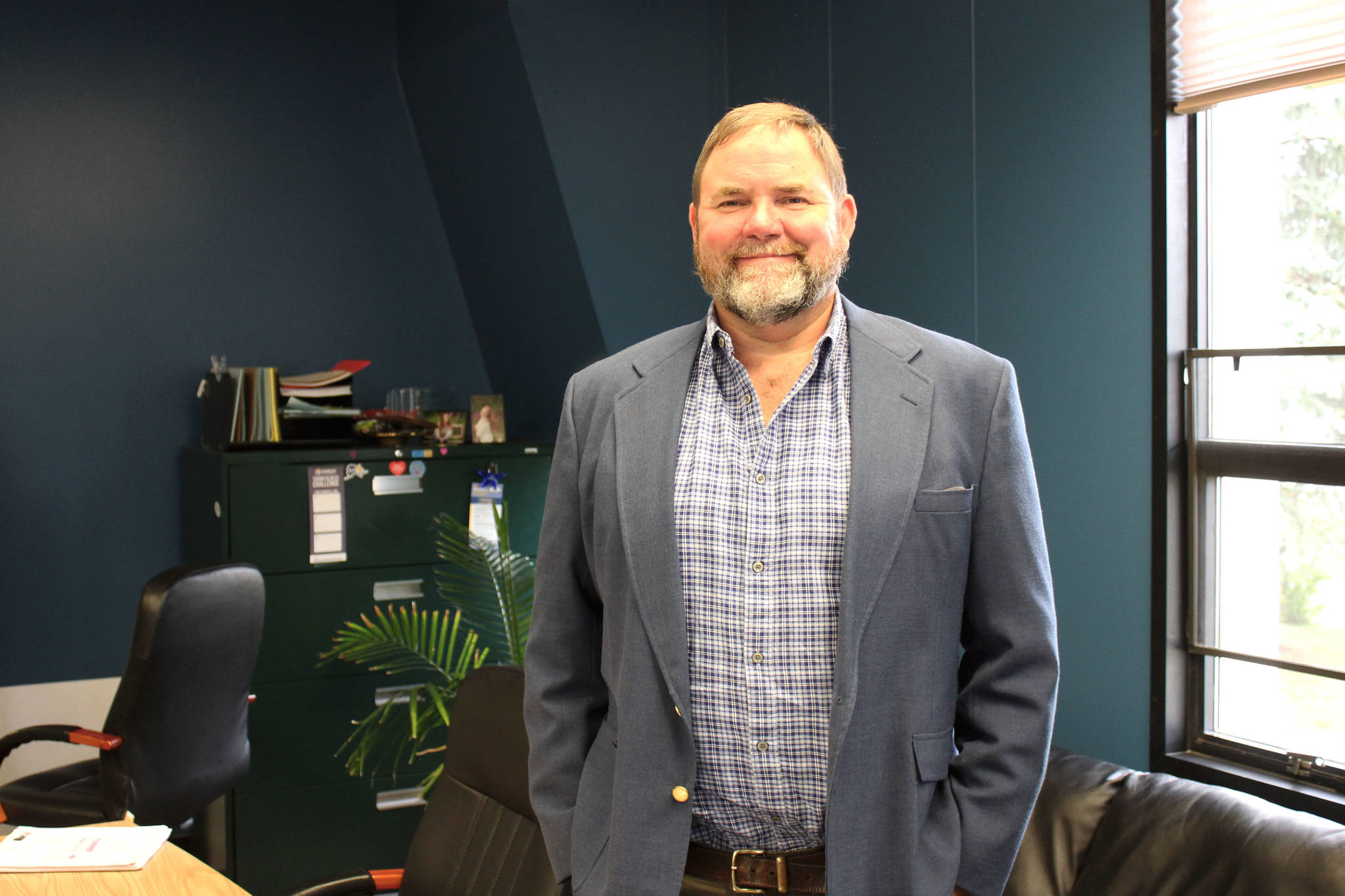 Clayton Holland stands in his office at the George A. Navarre Borough Admin Building on Thursday, July 22, 2021 in Soldotna, Alaska. (Ashlyn O'Hara/Peninsula Clarion)