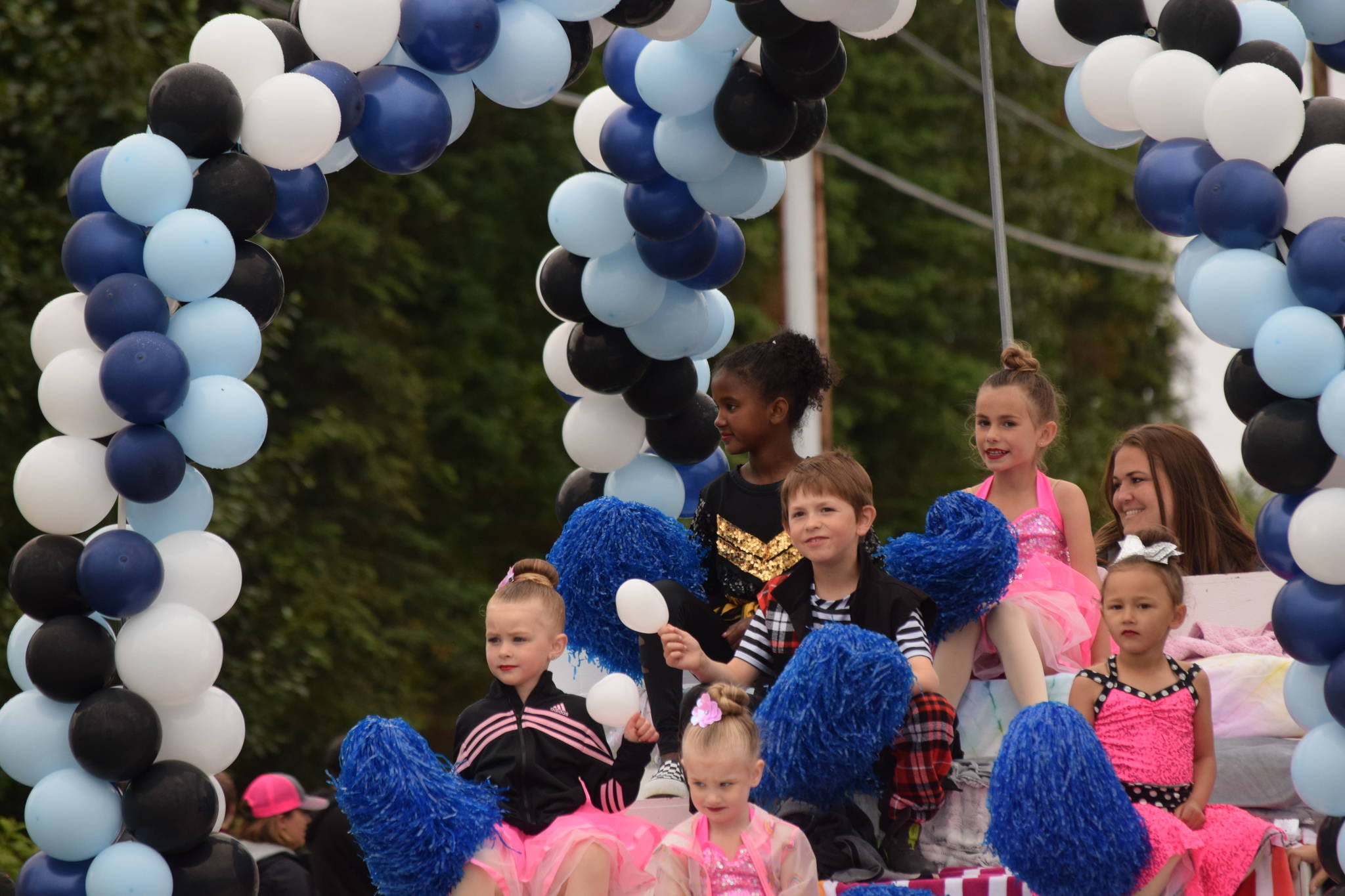 Members of Forever Dance Alaska ride their float during the Soldotna Progress Days parade on Saturday, July 24, 2021. (Camille Botello / Peninsula Clarion)