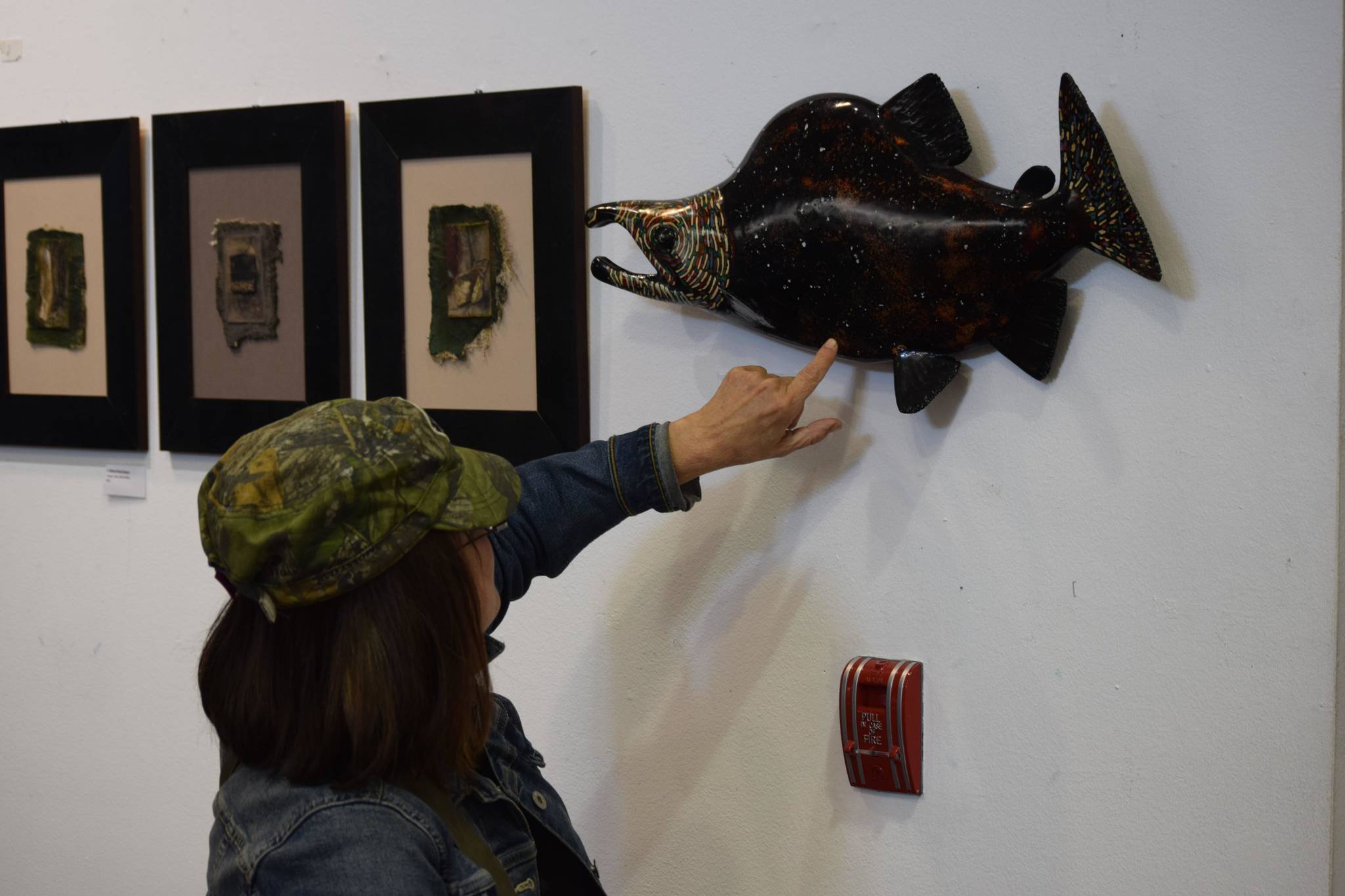 Kathy Matta discusses her lacquer art pieces at the Kenai Chamber of Commerce and Visitor Center on Tuesday, July 27, 2021. (Camille Botello / Peninsula Clarion)