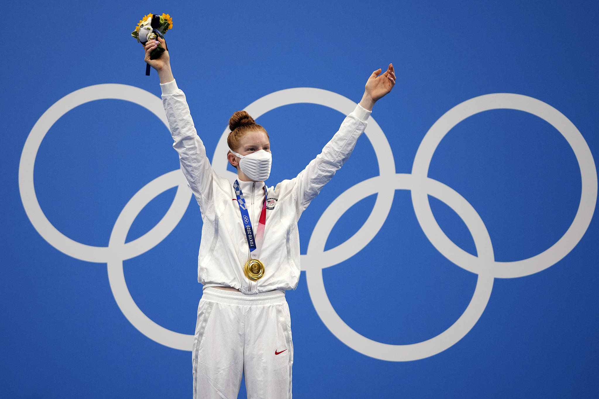 Gold medalist Lydia Jacoby of the United States celebrates on the podium after the final of the women’s 100-meter breaststroke at the 2020 Summer Olympics, Tuesday, July 27, 2021, in Tokyo, Japan.(AP Photo / Matthias Schrader)