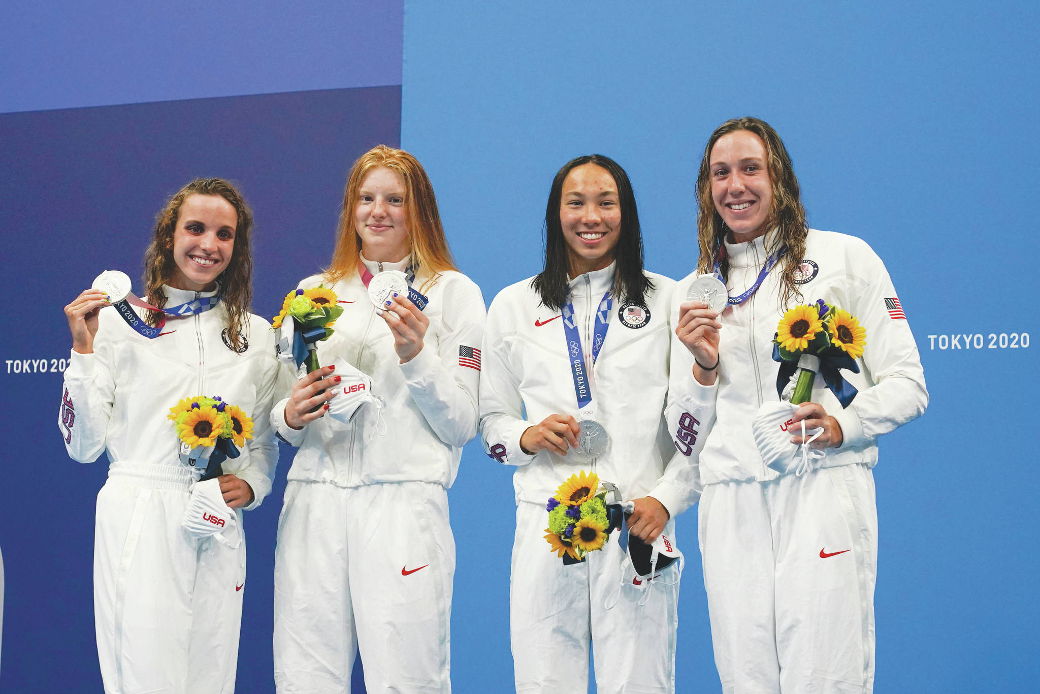 AP Photo / Gregory Bull 
The United States’ women’s 4x100-meter medley relay team, Regan Smith, Lydia Jacoby, Torri Huske and Abbey Weitzeil, celebrates at the podium Sunday after winning the silver medal at the 2020 Summer Olympics in Tokyo, Japan.