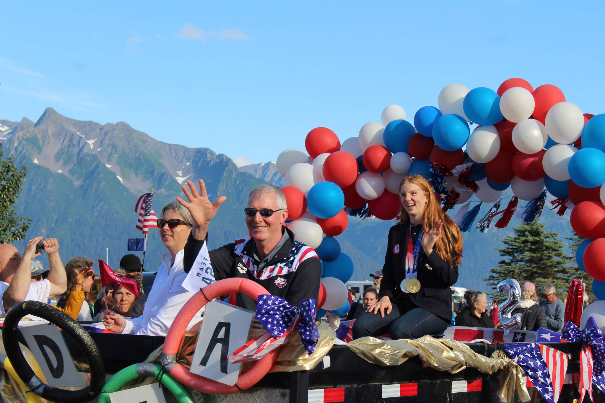 Olympic gold medalist Lydia Jacoby waves to the crowd in Seward during her celebratory parade on Thursday, August 5, 2021. (Ashlyn O'Hara/Peninsula Clarion)