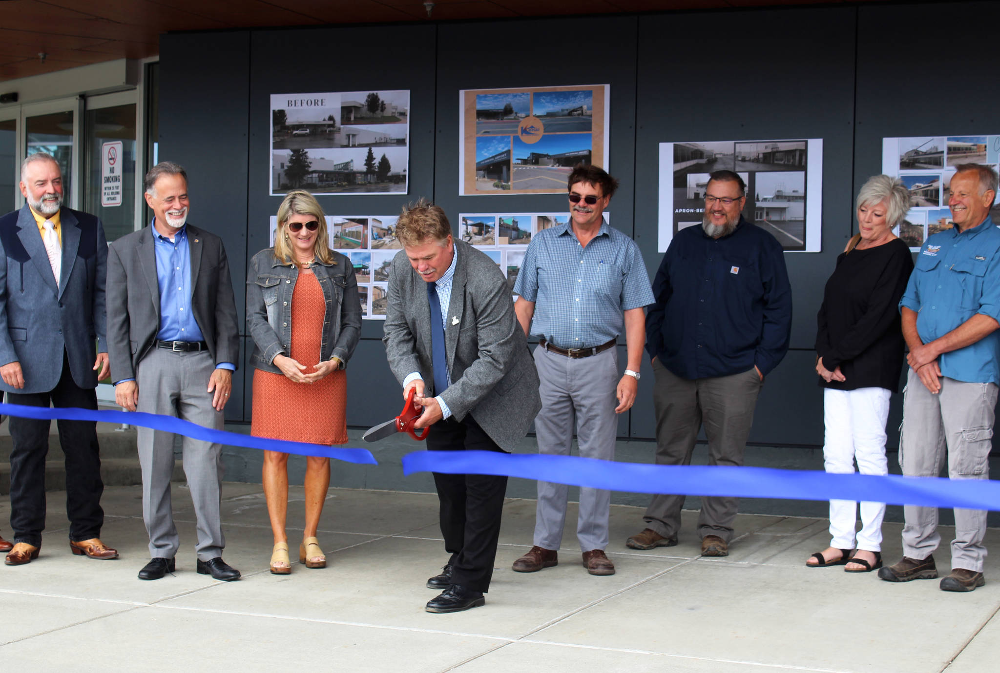 Kenai Mayor Brian Gabriel cuts a ribbon during a ceremony at Kenai Municipal Airport on Friday, Aug. 6, 2021 in Kenai, Alaska. (Ashlyn O’Hara/Peninsula Clarion)