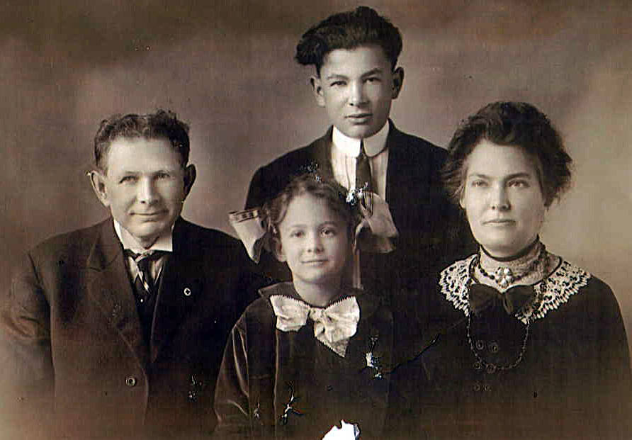 Photo from Ancestry.com 
This circa 1913 Alcorn family portrait shows Dr. R. J. Alcorn, his son Argie, his daughter Wilma, and his wife, Dr. Cora E. Alcorn.