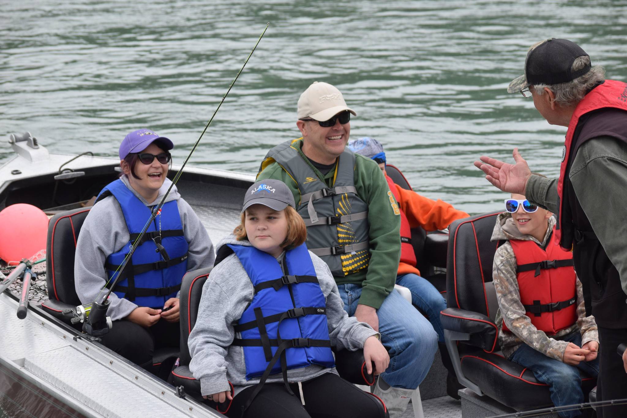 Participants in the Kenai River Junior Classic head down the Kenai River near Big Eddy Road in Soldotna, Alaska, on Wednesday, Aug. 11, 2021. (Camille Botello/Peninsula Clarion)