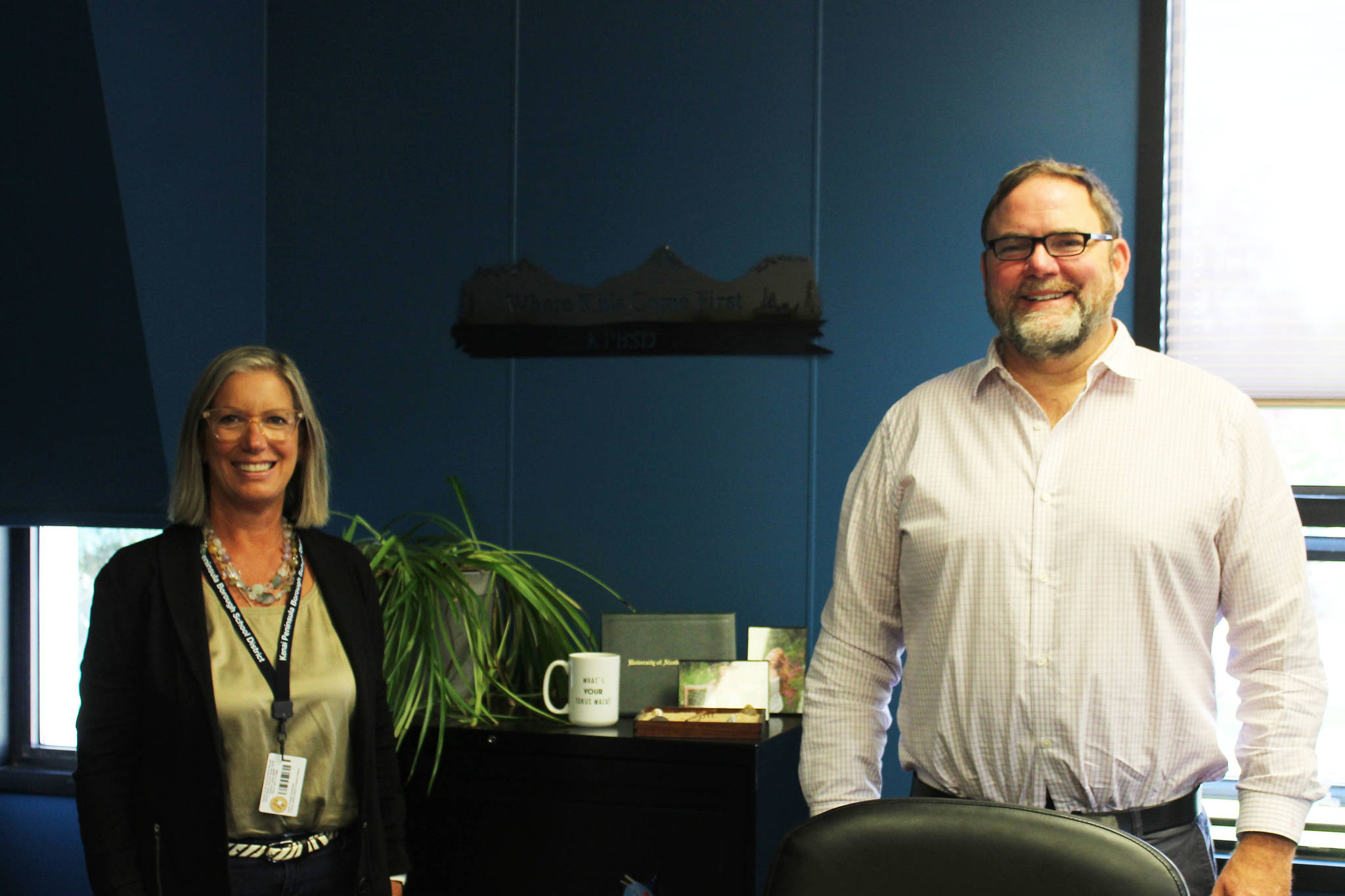 Kenai Peninsula Borough School District Communications Director Pegge Erkeneff (left) and Kenai Peninsula Borough School District Superintendent Clayton Holland stand in Holland’s office in the George A. Navarre Borough Admin Building on Friday, Aug. 13 in Soldotna, Alaska. (Ashlyn O’Hara/Peninsula Clarion)