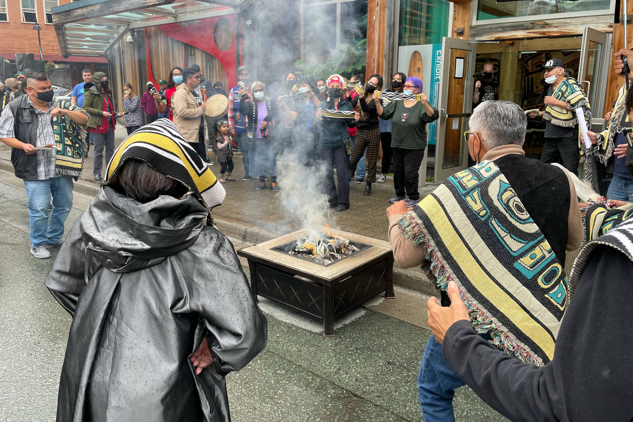 Michael S. Lockett / Juneau Empire
Participants burn an example of a commercial garment that led to a now-settled intellectual property lawsuit in a ceremony commemorating the settlement with the fashion company on Friday.