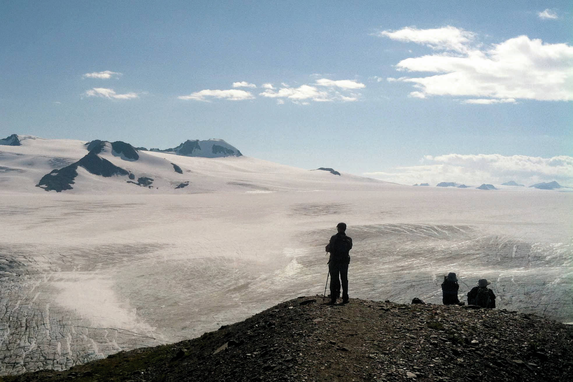 Hikers look at the Harding Icefield in August 2015 in Kenai Fjords National Park, just outside of Seward, Alaska. (Photo by Jeff Helminiak/Peninsula Clarion)