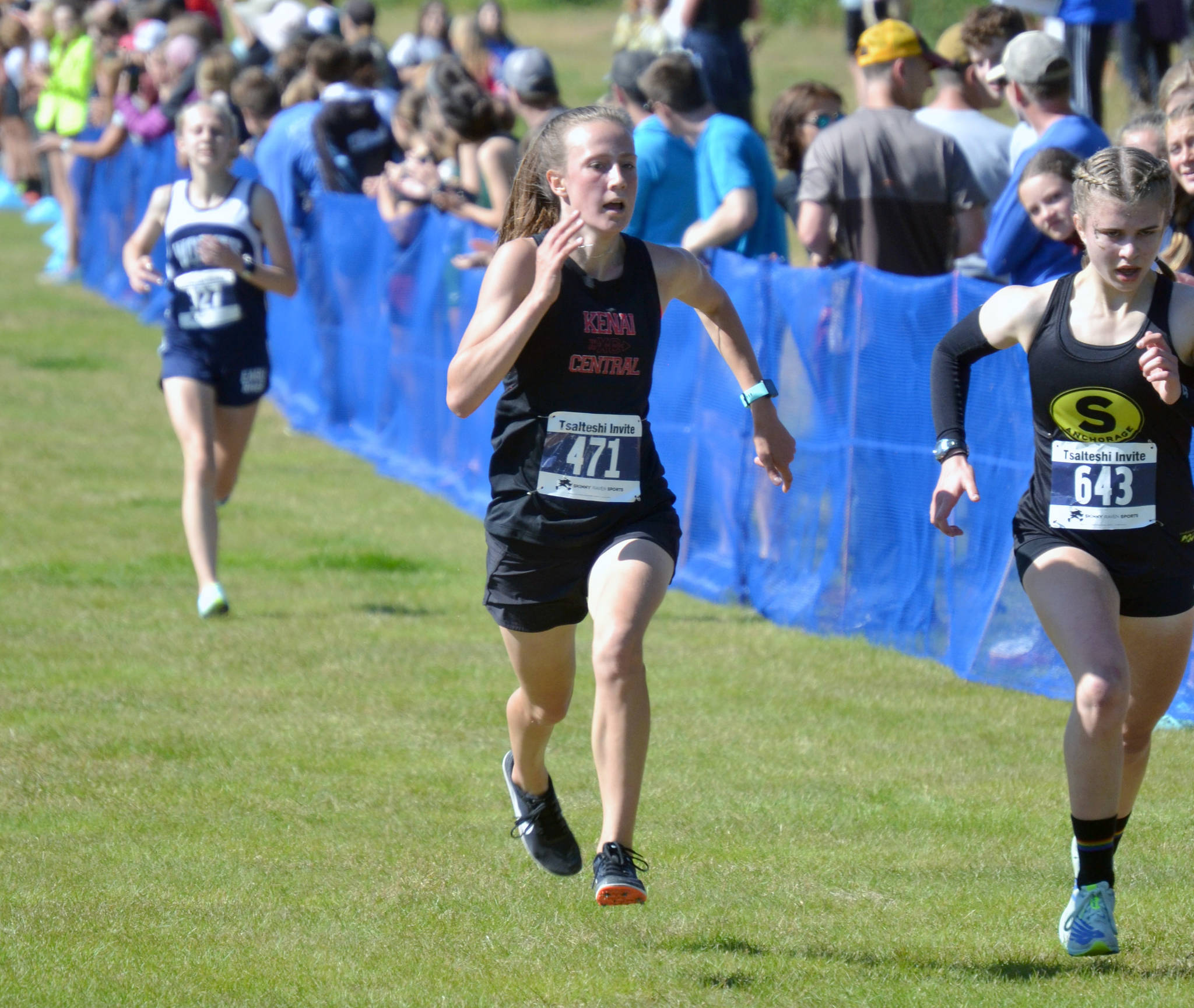 Kenai Central’s Jayna Boonstra kicks to eighth place in the girls varsity race at the Ted McKenney XC Invitational on Saturday, Aug. 21, 2021, at Tsalteshi Trails just outside of Soldotna, Alaska. (Photo by Jeff Helminiak/Peninsula Clarion)