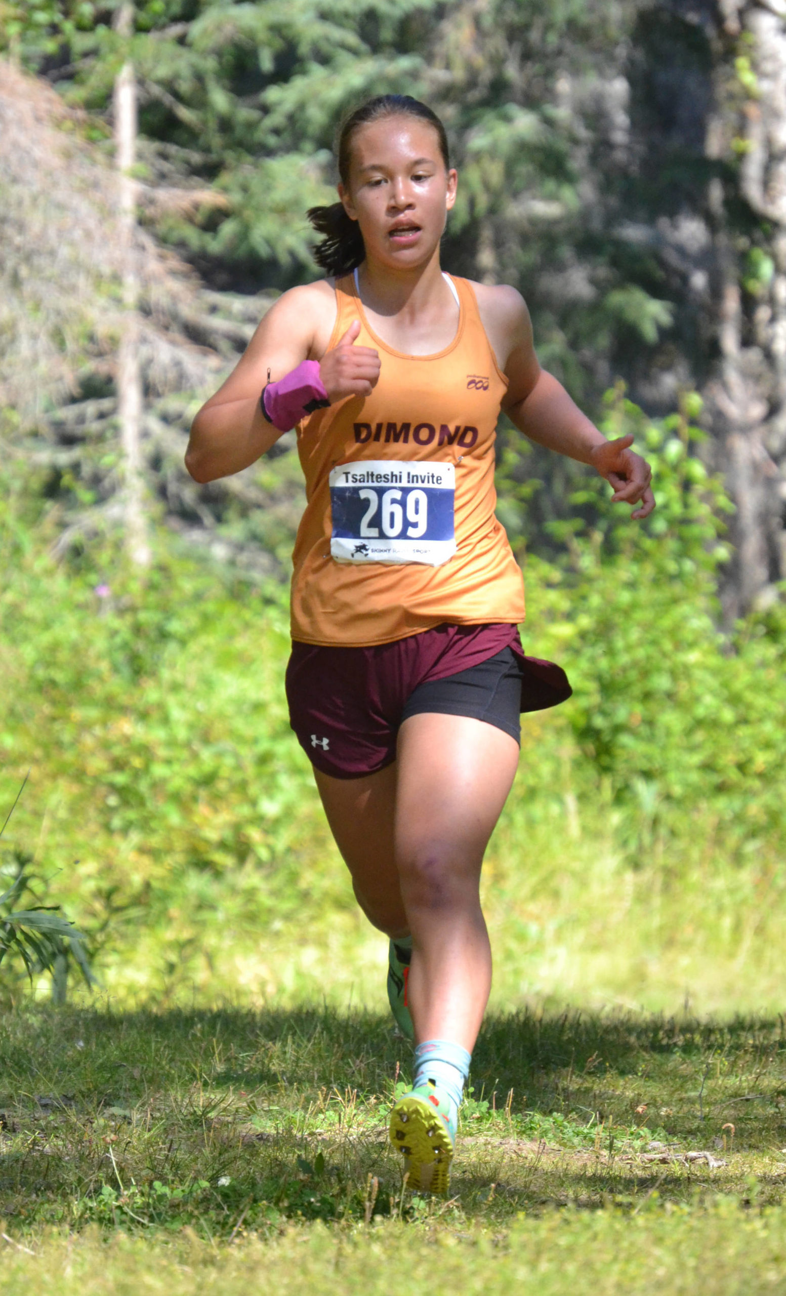 Dimond’s Emily Erickson runs to victory in the girls varsity race at the Ted McKenney XC Invitational on Saturday, Aug. 21, 2021, at Tsalteshi Trails just outside of Soldotna, Alaska. (Photo by Jeff Helminiak/Peninsula Clarion)