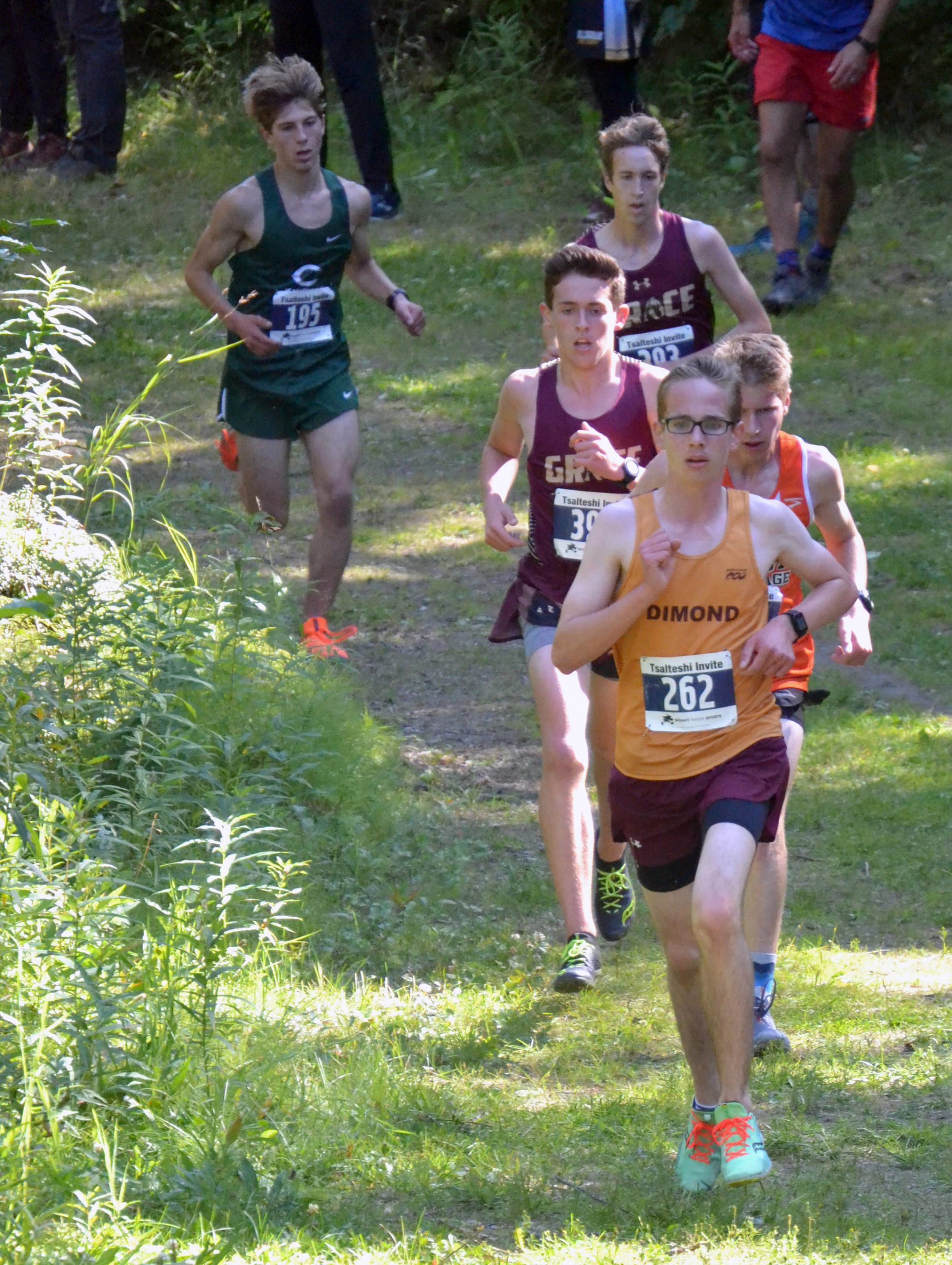 Dimond’s Jared Gardiner takes the lead for good in the boys varsity race at the Ted McKenney XC Invitational on Saturday, Aug. 21, 2021, at Tsalteshi Trails just outside of Soldotna, Alaska. (Photo by Jeff Helminiak/Peninsula Clarion)