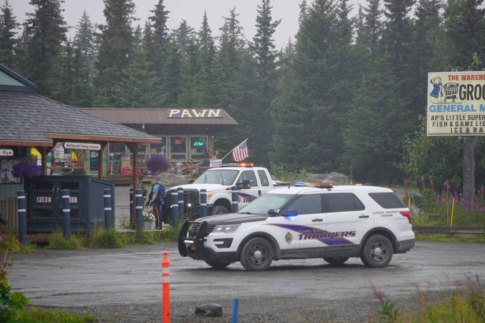Alaska State Troopers investigate a shooting of a trooper at the Anchor Point Warehouse on Monday, Aug. 23, 2021, in Anchor Point, Alaska. (Photo by Michael Armstrong/ Homer News)