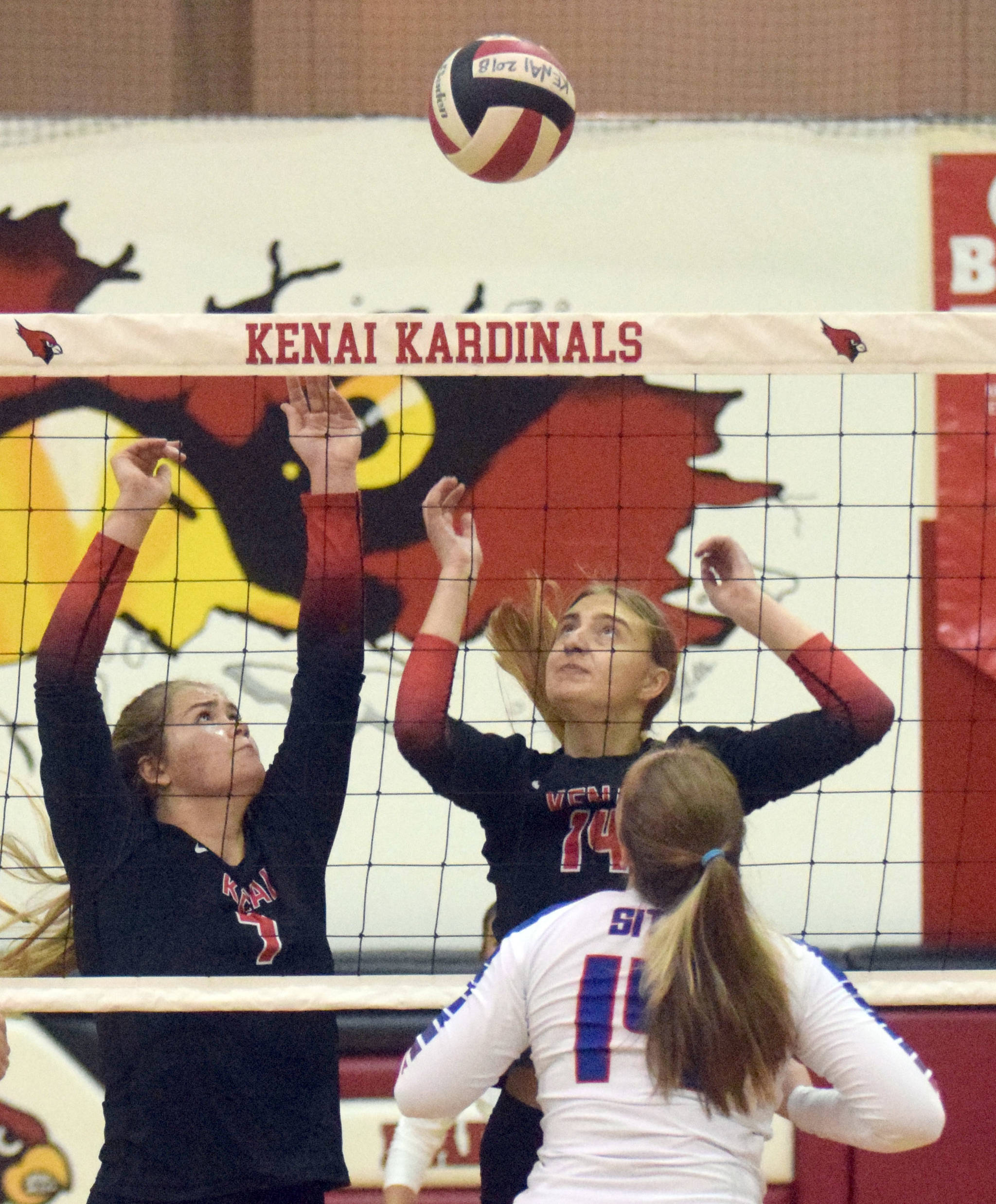 Kenai Central’s Emma Beck and Erin Koziczkowski put up a block on Sitka on Wednesday, Aug. 25, 2021, at Kenai Central High School in Kenai, Alaska. (Photo by Jeff Helminiak/Peninsula Clarion)