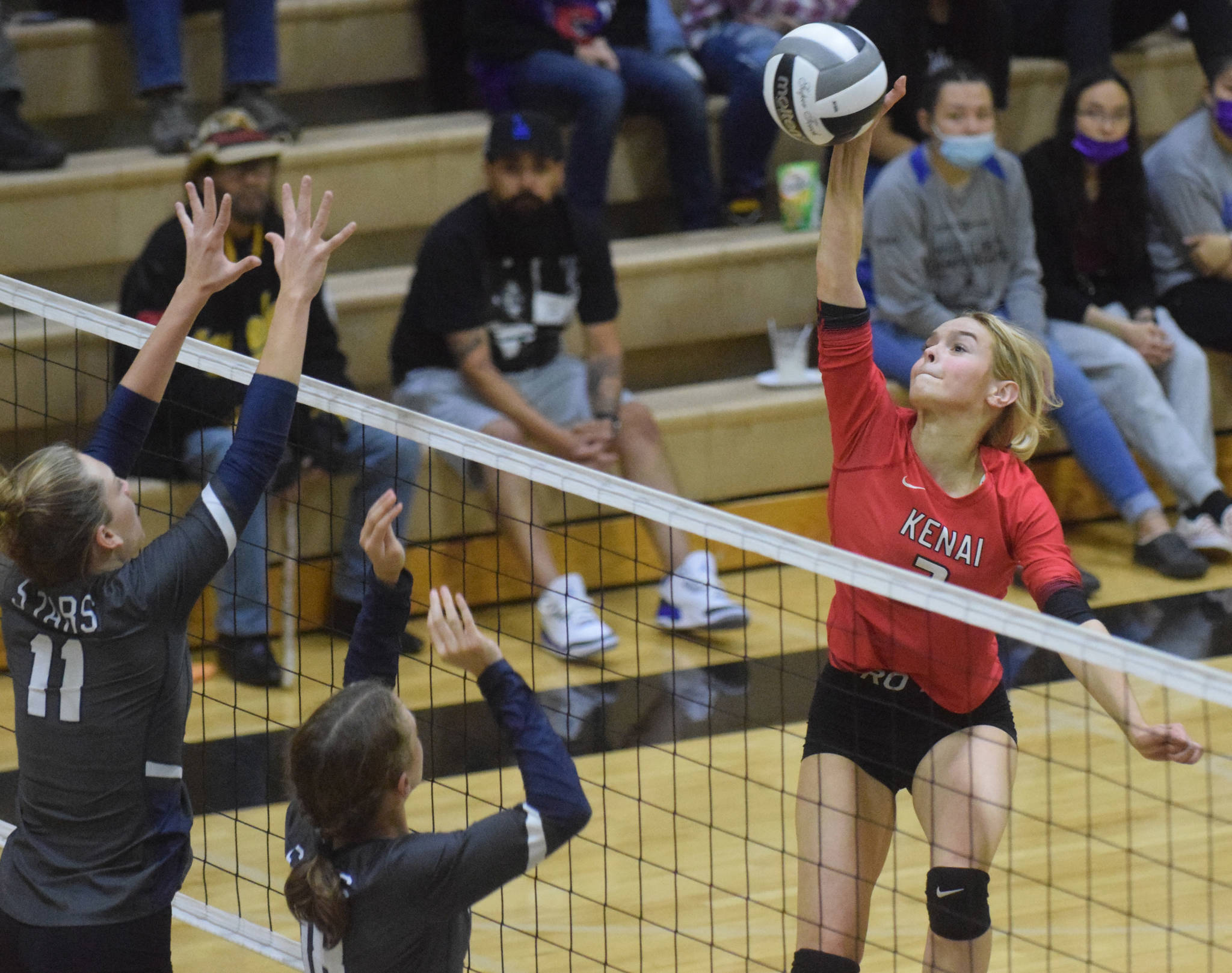 Kenai Central’s Cali Holmes attacks Soldotna in the final of the Shayna Pritchard Memorial Volleyball Tournament on Saturday at Nikiski High School in Nikiski. (Photo by Jeff Helminiak/Peninsula Clarion)