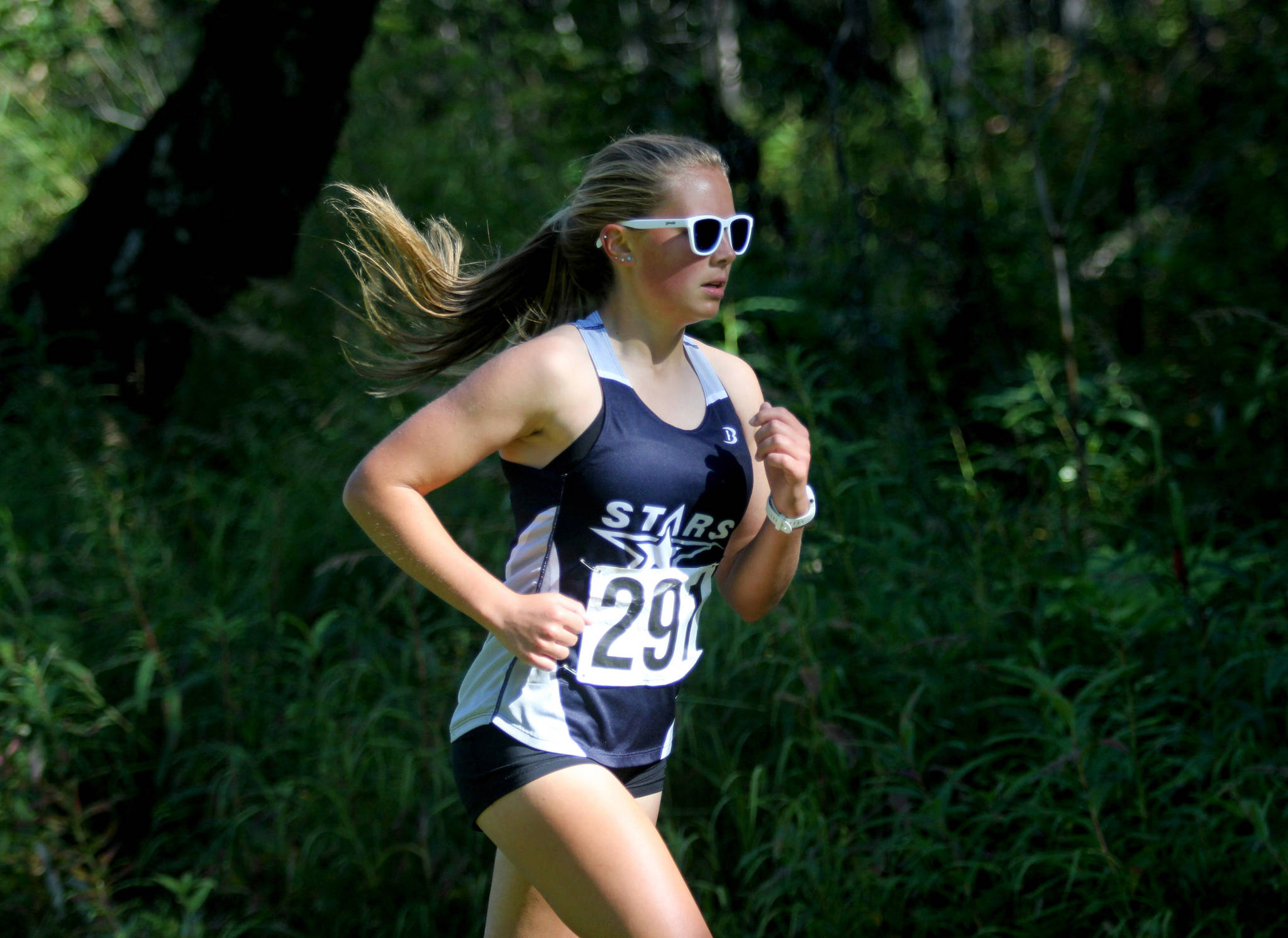 Soldotna’s Jordan Strausbaugh makes her way down the course during the Colony Invitational on Saturday, Aug. 28, 2021, at Colony High School. Strausbaugh finished fourth. (Photo by Jeremiah Bartz/Frontiersman)