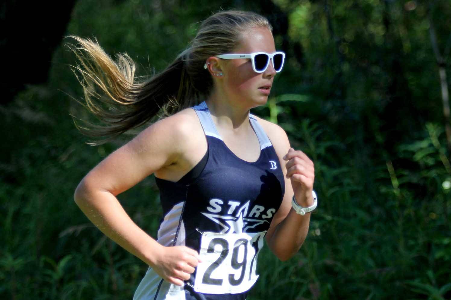 Soldotna’s Jordan Strausbaugh makes her way down the course during the Colony Invitational on Saturday, Aug. 28, 2021, at Colony High School. Strausbaugh finished fourth. (Photo by Jeremiah Bartz/Frontiersman)