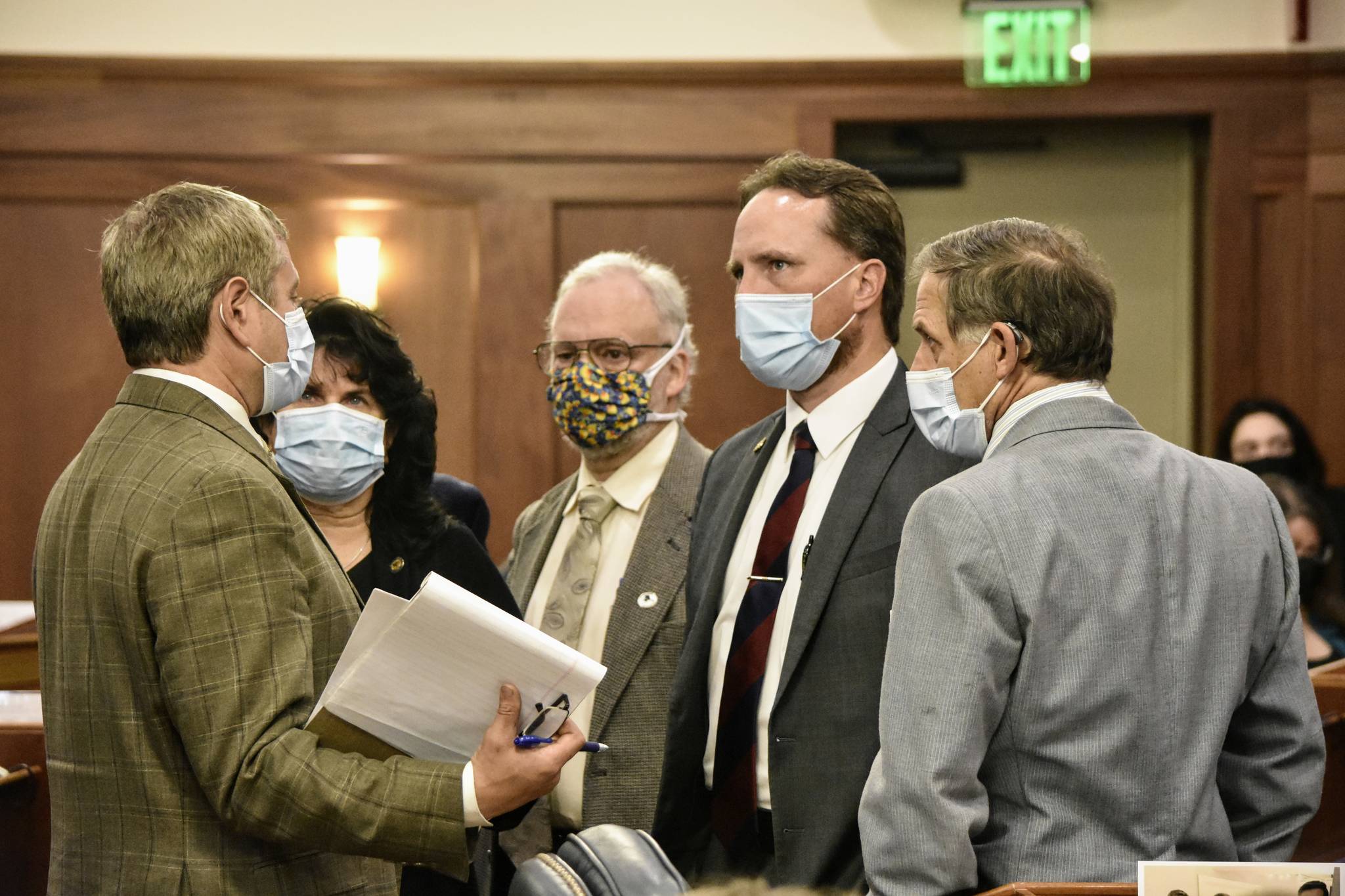 From left to right, House Majority Leader Chris Tuck, D-Anchorage; House Minority Leader Cathy Tilton, R-Wasilla and Reps. Mike Prax, R-North Pole; Ben Carpenter, R-Nikiski and George Rauscher, R-Sutton, speak on the floor of the Alaska House of Representatives following a floor session on Monday, Aug. 30, 2021. Lawmakers found themselves debating familiar topics as they worked through amendments to a budget bill. (Peter Segall / Juneau Empire)