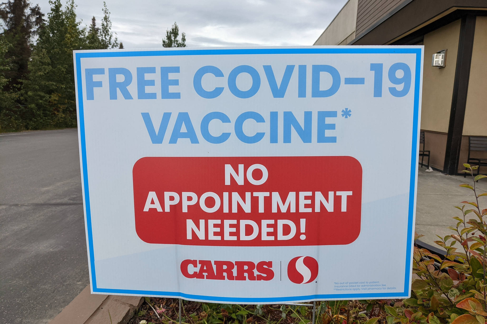 A sign advertising free COVID-19 vaccines stands outside Safeway on Wednesday, Sept. 1, 2021, in Kenai, Alaska. (Photo by Erin Thompson/Peninsula Clarion)