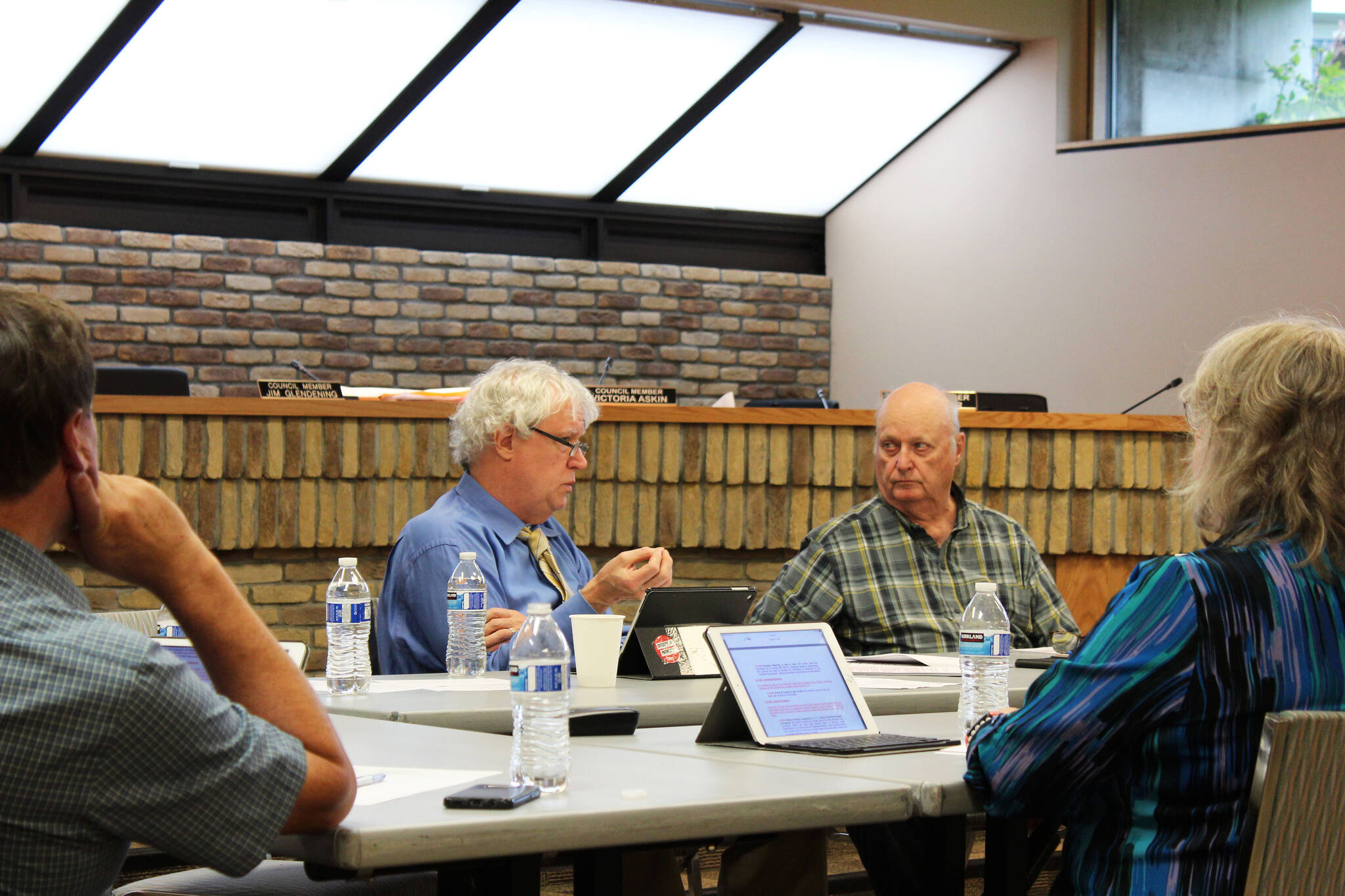 Kenai Vice Mayor and Kenai City Council member Bob Molloy (center), council member Jim Glendening (right), council member Victoria Askin (far right), and council member Henry Knackstedt (far left) participate in a work session discussing the overhaul of Kenai election codes on Wednesday at Kenai City Hall.