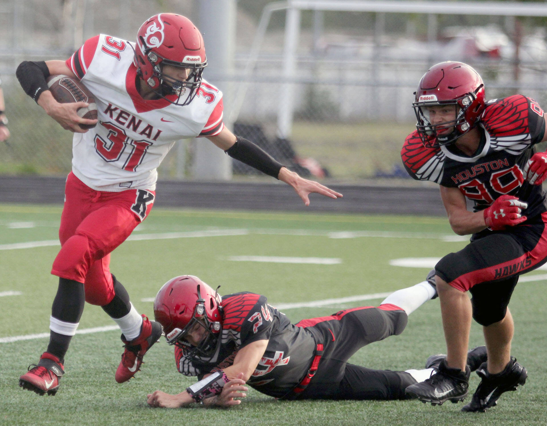 Kenai’s Levi Good tries to break outside during a 32-2 loss to the Houston Hawks on Friday, Sept. 3, 2021, in Houston, Alaska. (Photo by Jeremiah Bartz/Frontiersman)