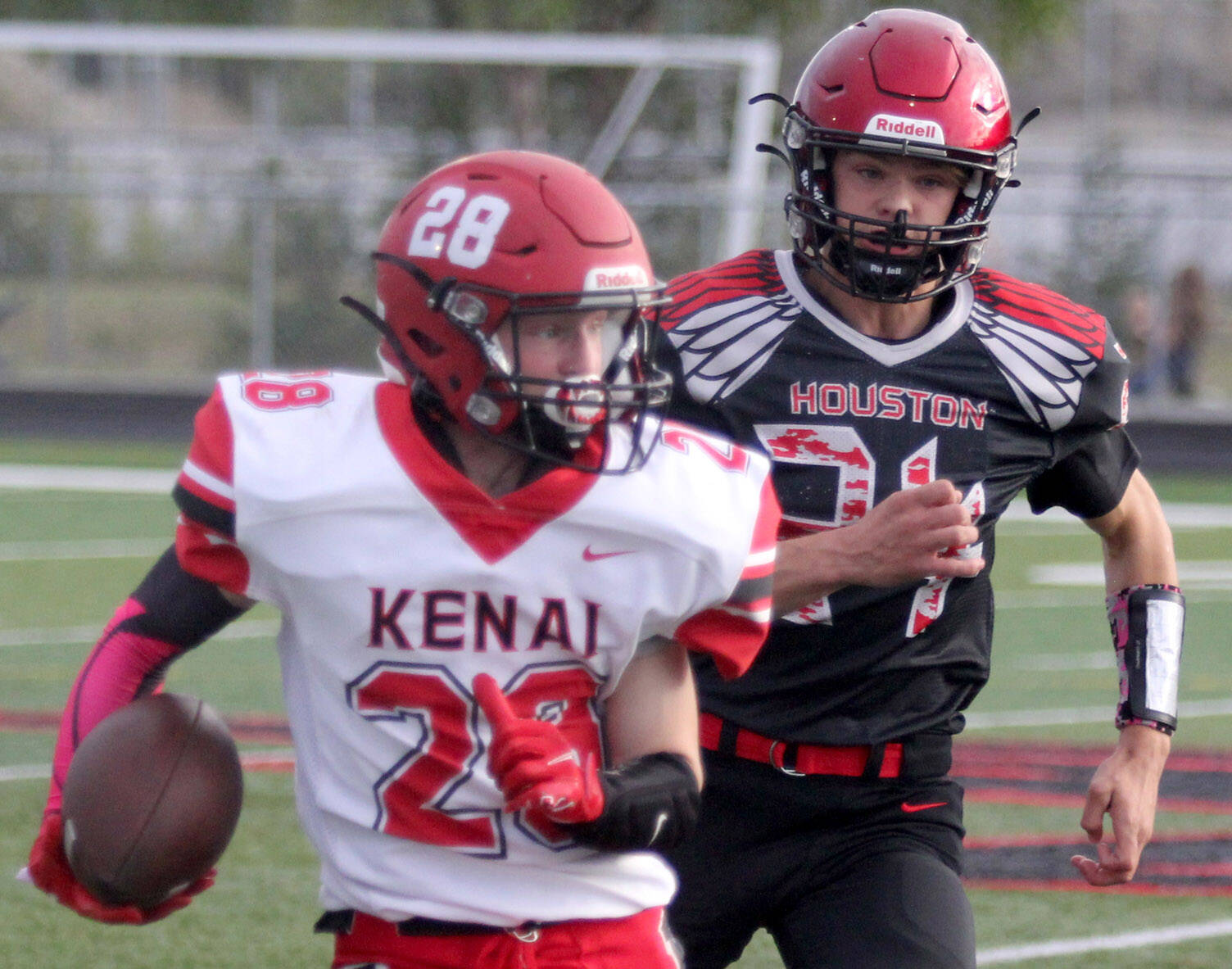 Kenai’s James Sparks runs for a gain after a catch during a loss to Houston on Friday, Sept. 3, 2021, in Houston, Alaska. (Photo by Jeremiah Bartz/Frontiersman)