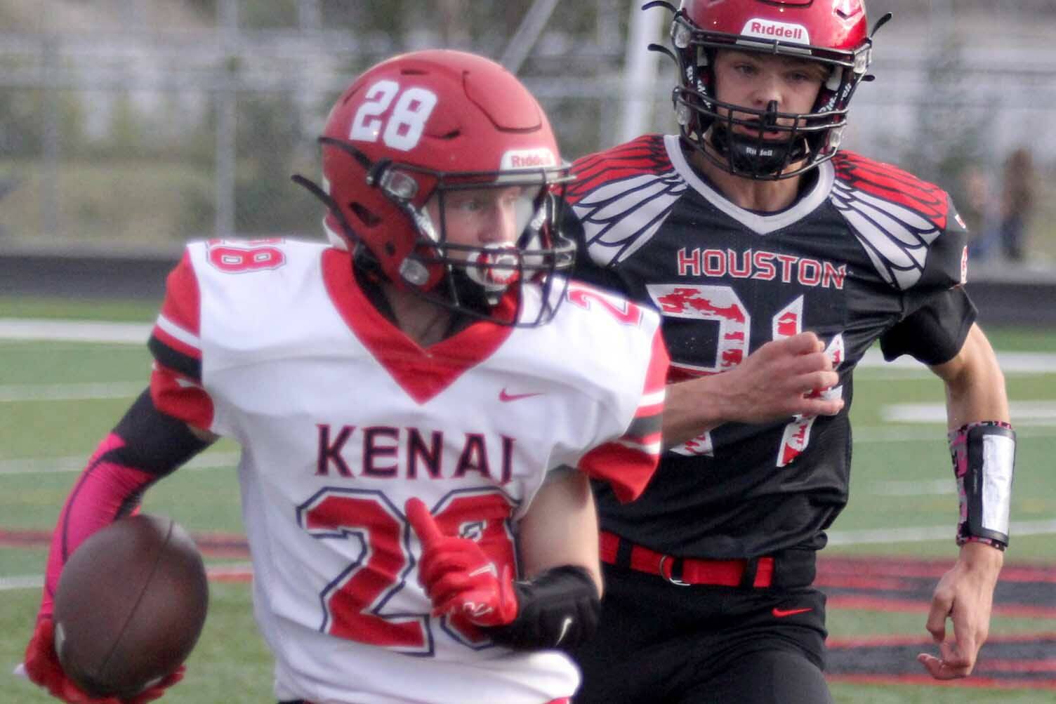 Kenai’s James Sparks runs for a gain after a catch during a loss to Houston on Friday, Sept. 3, 2021, in Houston, Alaska. (Photo by Jeremiah Bartz/Frontiersman)