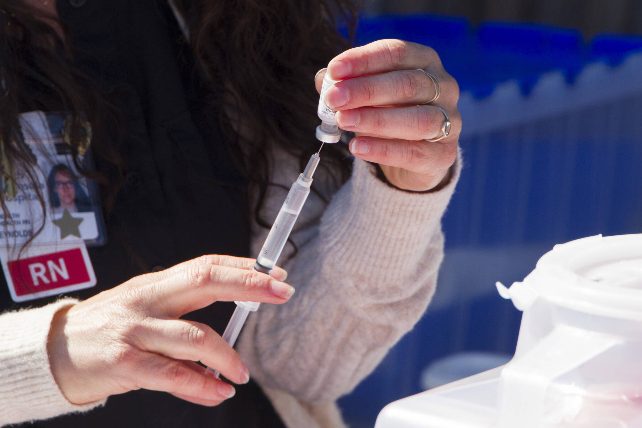 A registered nurse prepares a COVID-19 vaccine at the pop-up clinic on the Spit on May 27, 2021. (Photo by Sarah Knapp/Homer News)