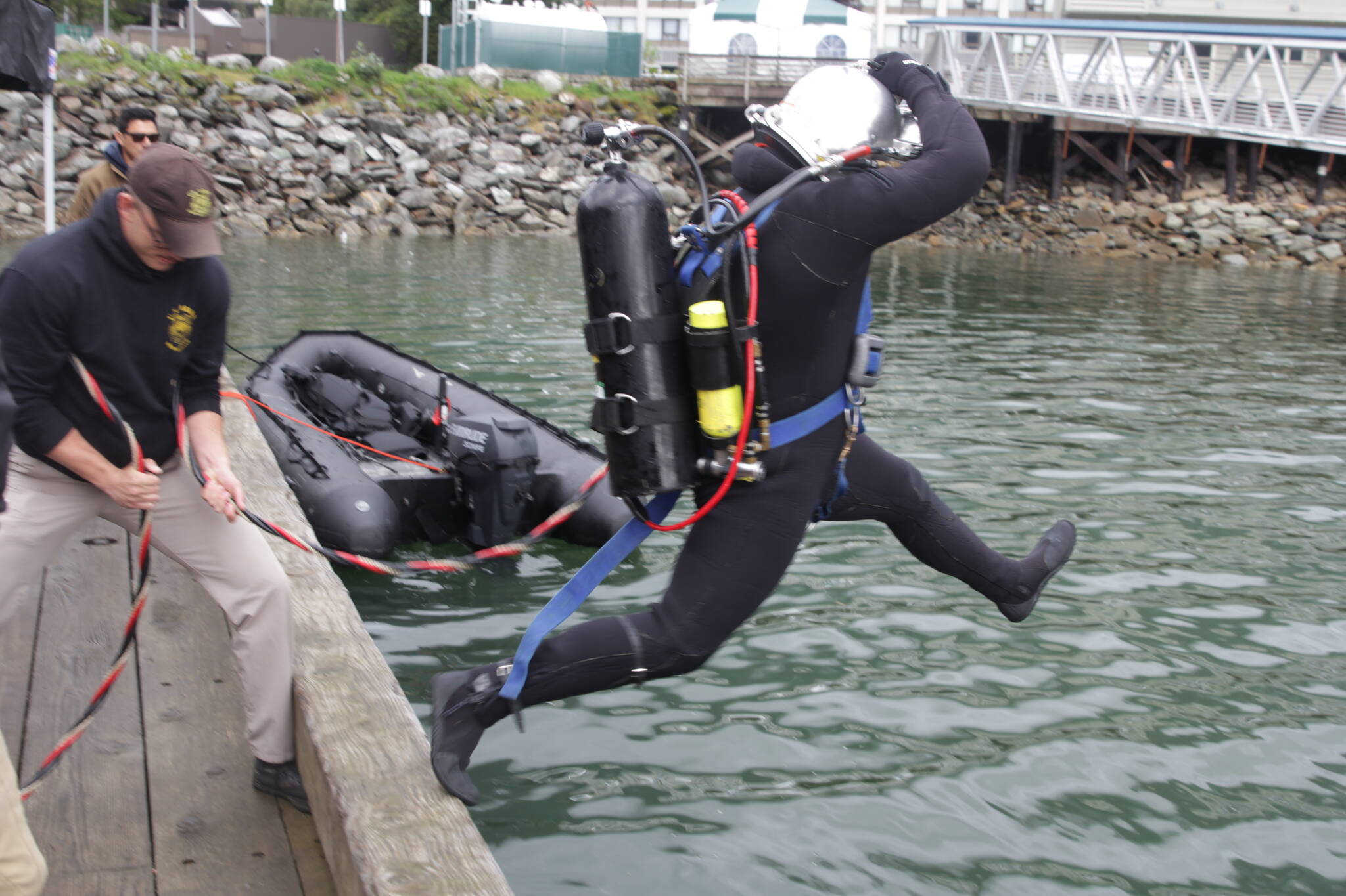 Courtesy photo / MyKenzie Robertson 
Army Pfc. Luke McCarty jumps in the water during training for the engineer divers Monday with a Coast Guard dive team.