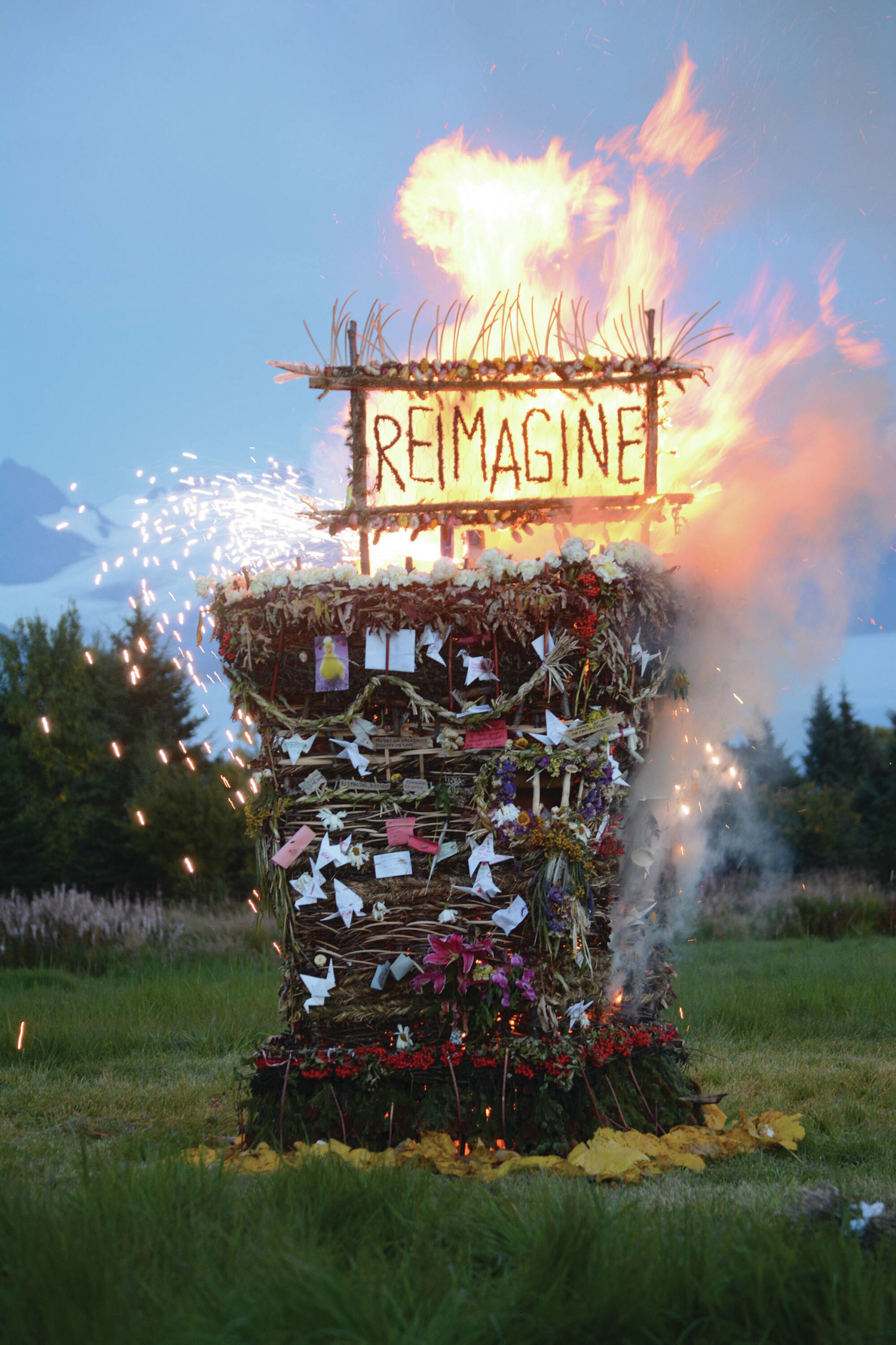 "Reimagine," the 17th annual Burning Basket, catches fire in a field on Sunday, Sept. 13, 2020, near Homer, Alaska. Artist Mavis Muller intended to broadcast live on Facebook and YouTube the burning of the basket, but because of technical difficulties that didn't happen.
"Burning Basket teaches how to let go of expectations and accept the present moment," Muller wrote in a text message. "Technology is fickle. The basket, however, did exactly what it promised to do. It helod our collective burderns, our memorials, our joys, sadness, fear, and dispersed all of our good intentions in a plume of smoke, sparks and flames." (Photo by Michael Armstrong/Homer News)