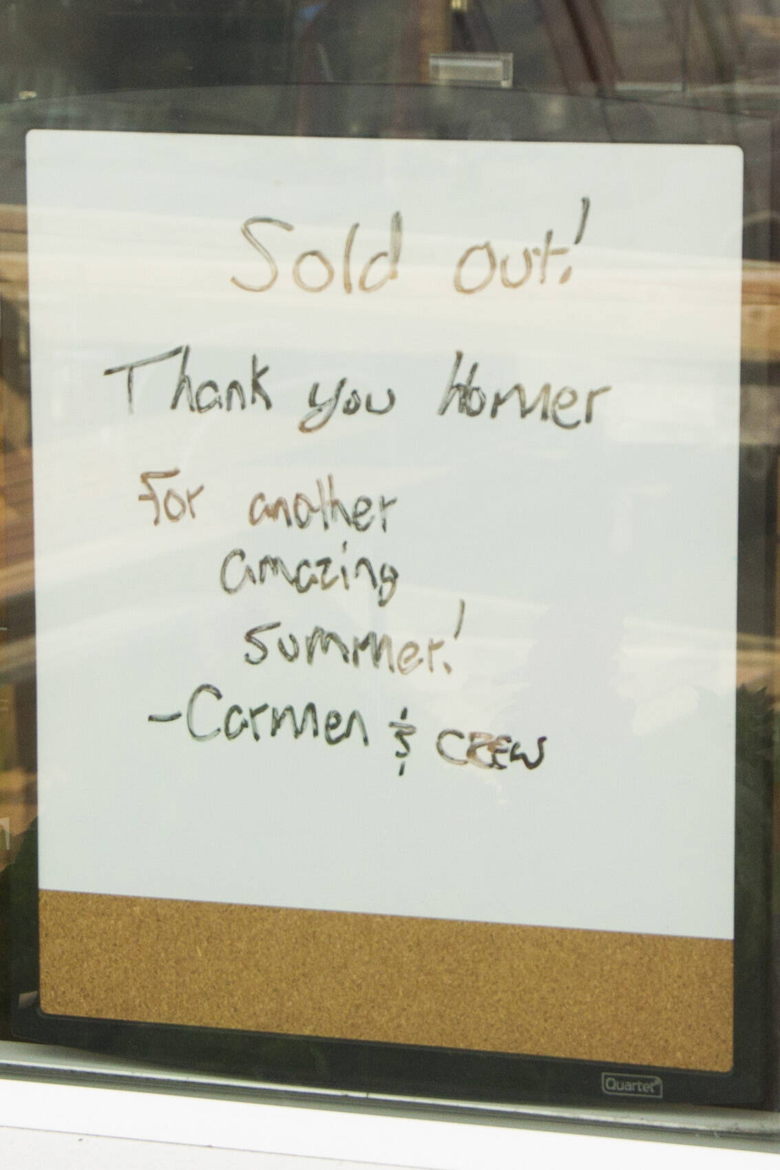 A sign in the Carmen's Gelato store front announces they are sold out for the season. (Photo by Sarah Knapp/Homer News)