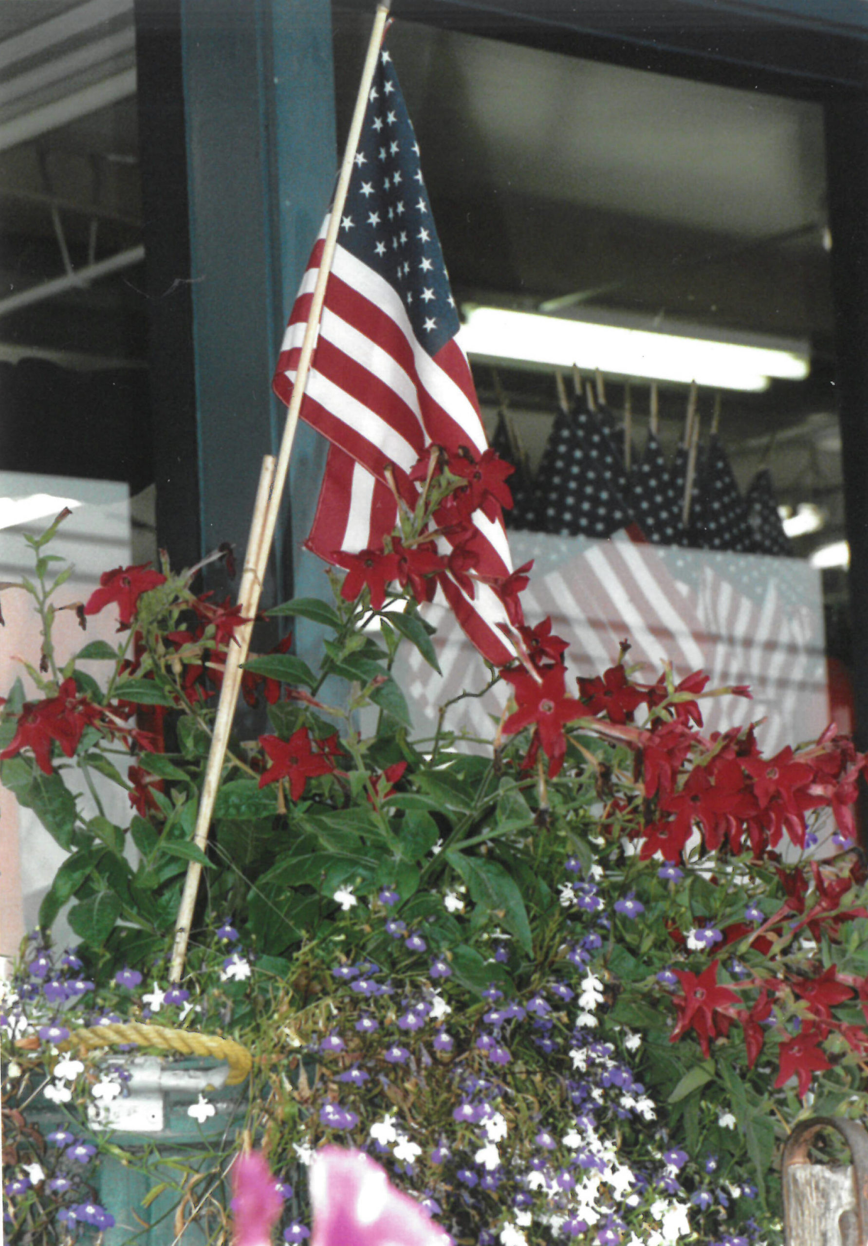 Twenty years ago after the attacks of Sept. 11, 2001, displays of U.S. flags were common, as seen here at NOMAR in Homer the week after the attacks. (Homer News file photo)