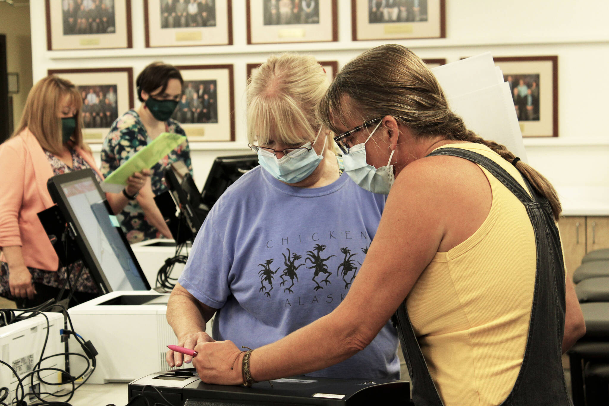 Linda Cusack (left) and Teri Birchfield (right) test a Dominion voting machine ahead of the Oct. 5 municipal election on Thursday, Sept. 9, 2021 in Soldotna, Alaska. (Ashlyn O’Hara/Peninsula Clarion)