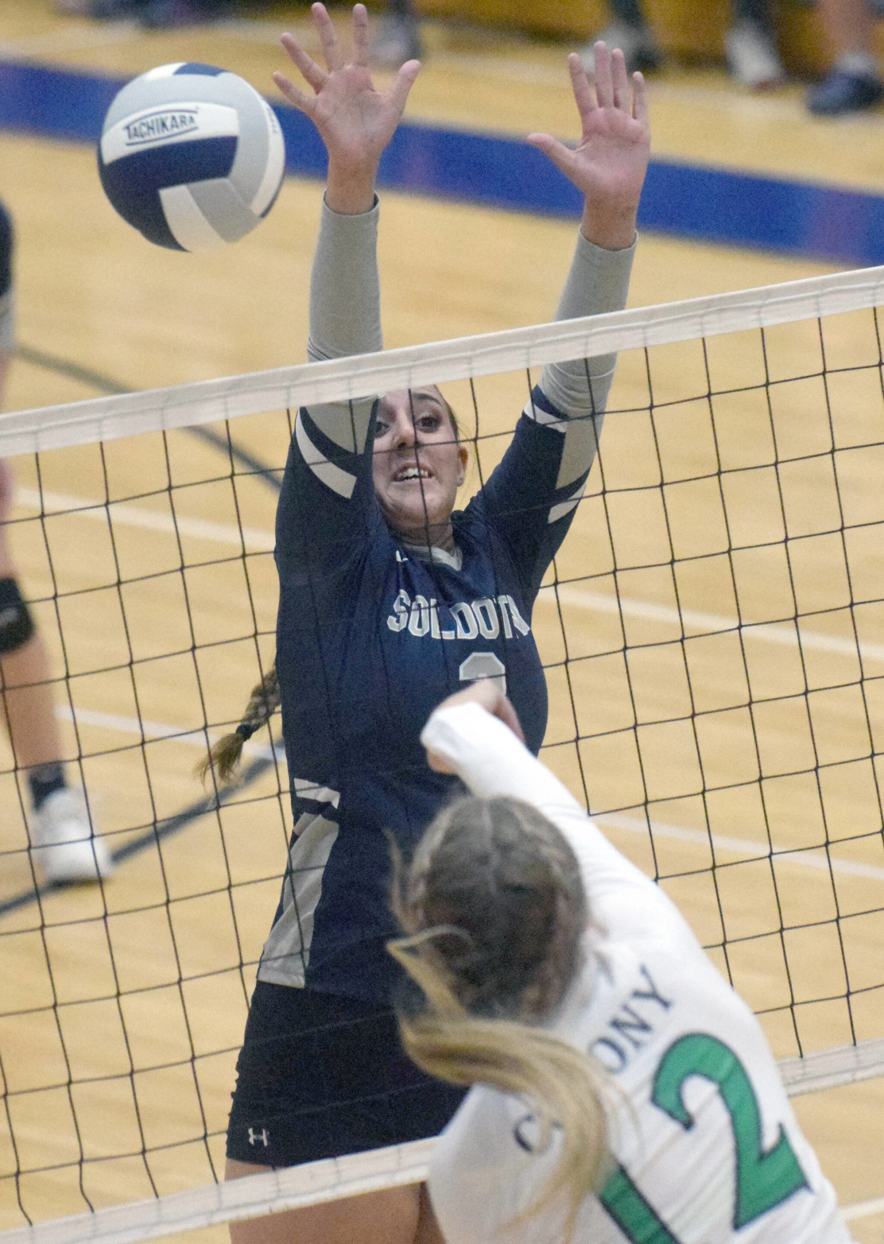 Soldotna’s Ashlee Anderson throws up a block on Colony’s Taylee Weiss on Thursday, Sept. 9, 2021, at Soldotna High School in Soldotna, Alaska. (Photo by Jeff Helminiak/Peninsula Clarion)