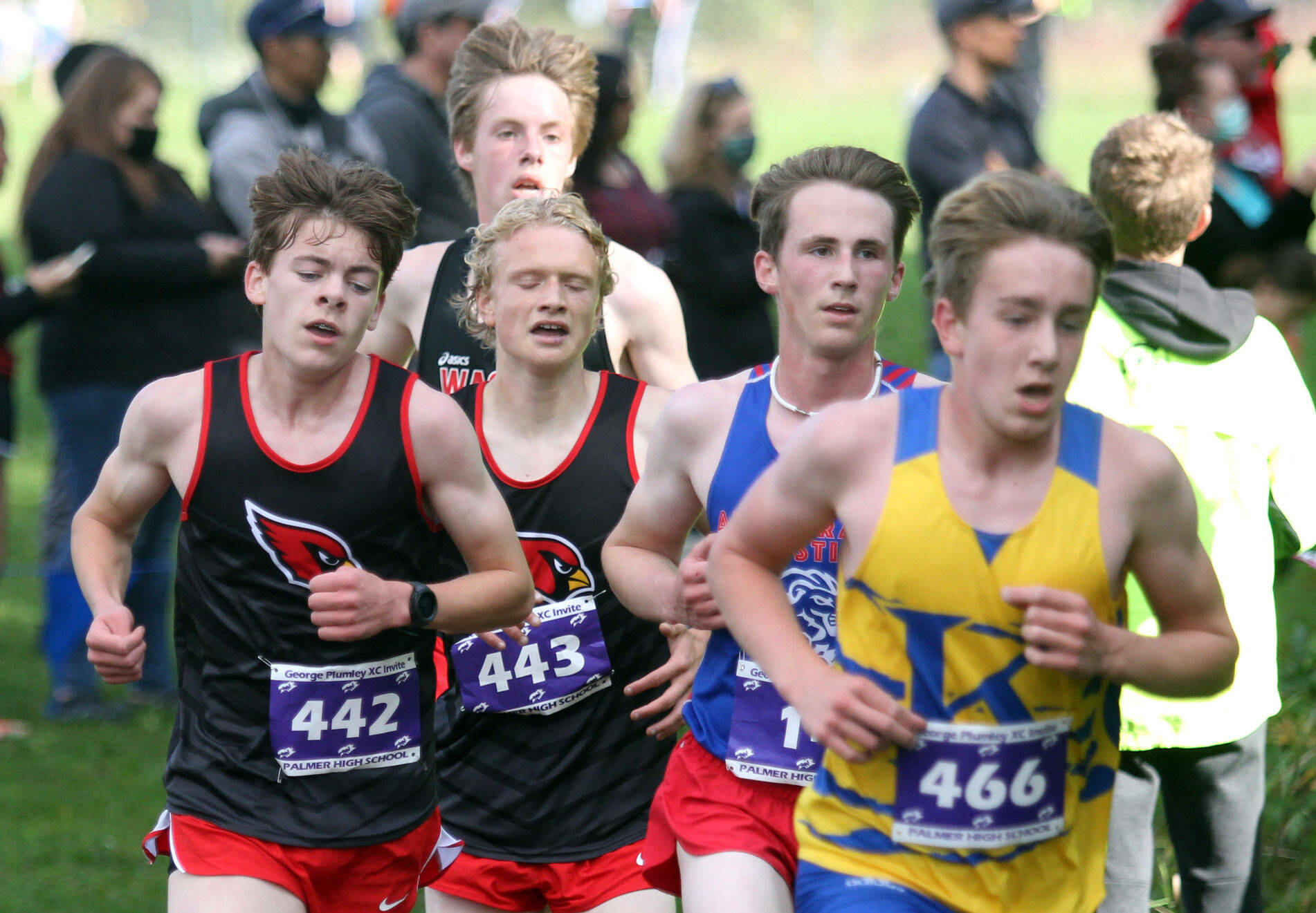 Kenai’s Gregory Fallon and Jack Laker try to gain position during the varsity boys race of the George Plumley Invitational on Saturday, Sept. 11, 2021, at Palmer High School. (Photo by Jeremiah Bartz/Frontiersman)