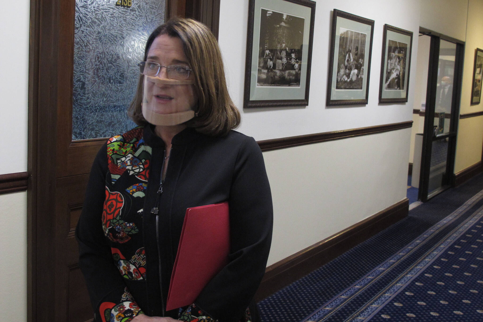 In this March 15, 2021, file photo, Alaska state Sen. Lora Reinbold, an Eagle River Republican, speaks to reporters in Juneau, Alaska. The Alaska state lawmaker has requested an excusal from the state Senate until mid-January, citing the challenges of traveling to Juneau after she was suspended from flying on Alaska Airlines earlier this year. (AP Photo/Becky Bohrer, Pool, File)