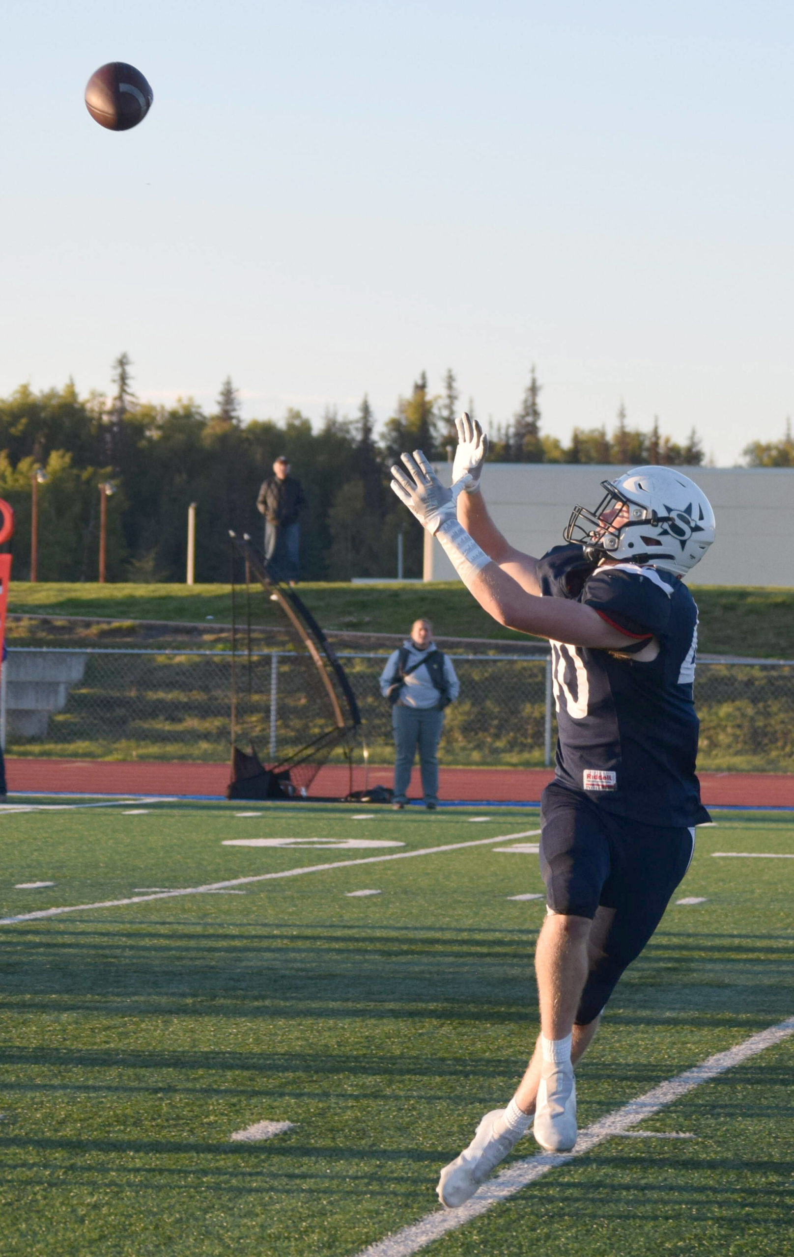 Dylan Dahlgren receives a long pass to score a touchdown during Soldotna High’s homecoming footall game at Justin Maile Field in Soldotna, Alaska, on Friday, Sept. 10, 2021. (Camille Botello/Peninsula Clarion)