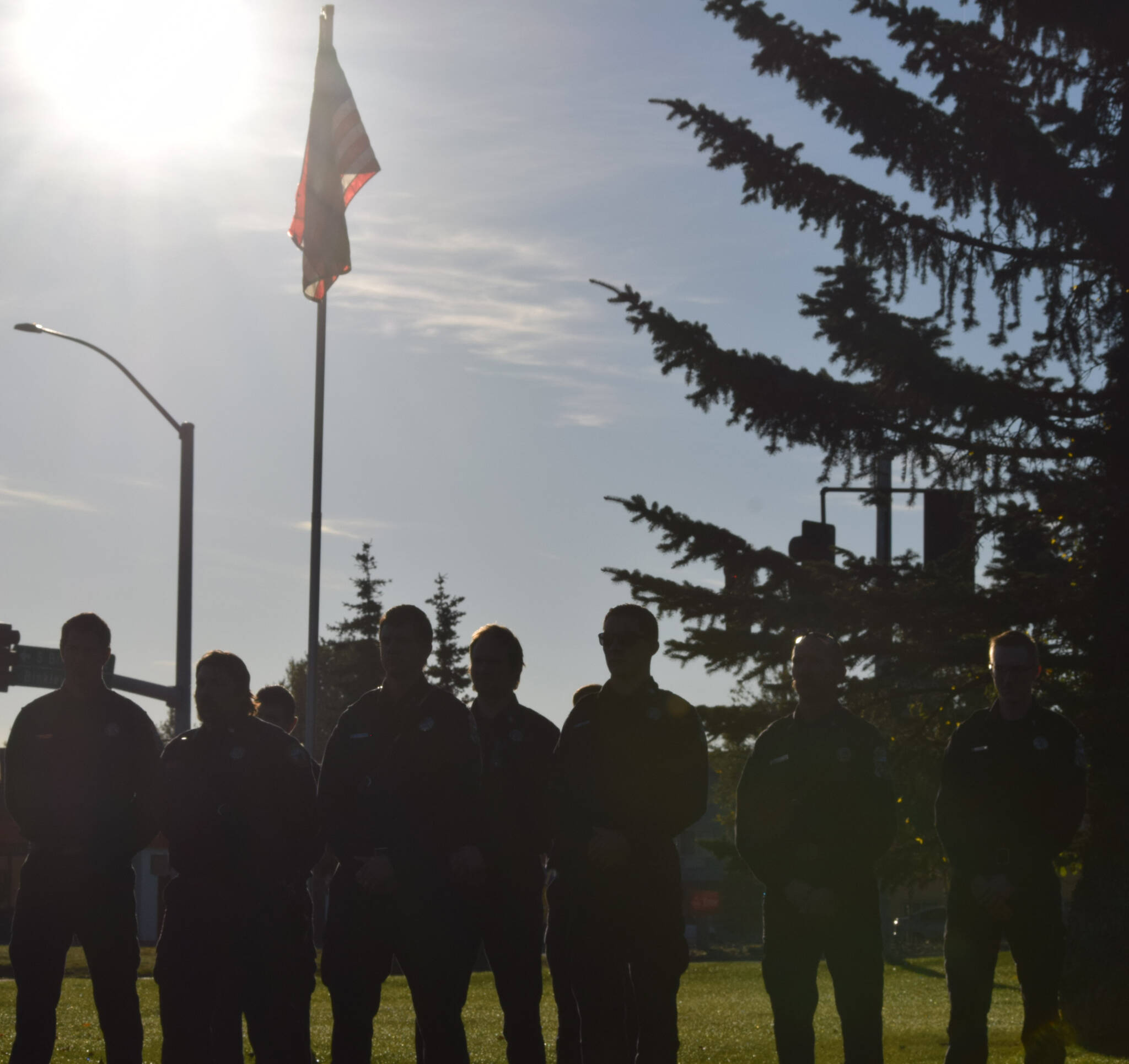 Firefighters pay their respects during the 20th memorial service of the 9/11 terrorist attacks at Central Emergency Services in Soldotna on Saturday, Sept. 11, 2021. (Camille Botello/Peninsula Clarion)