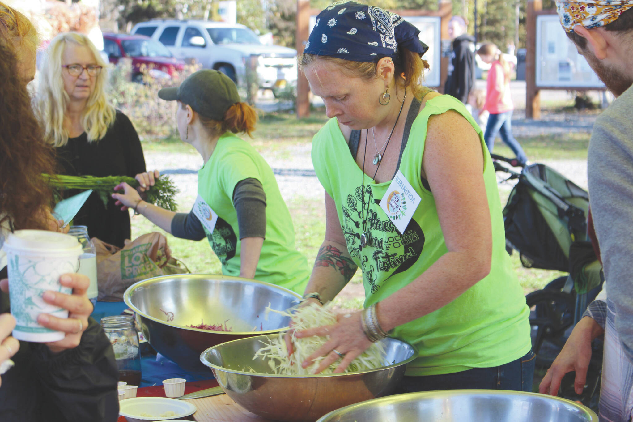Volunteers work the fermentation station at the Harvest Moon Local Food Festival at Soldotna Creek Park on Sept. 14, 2019. (Photo by Brian Mazurek/Peninsula Clarion file)