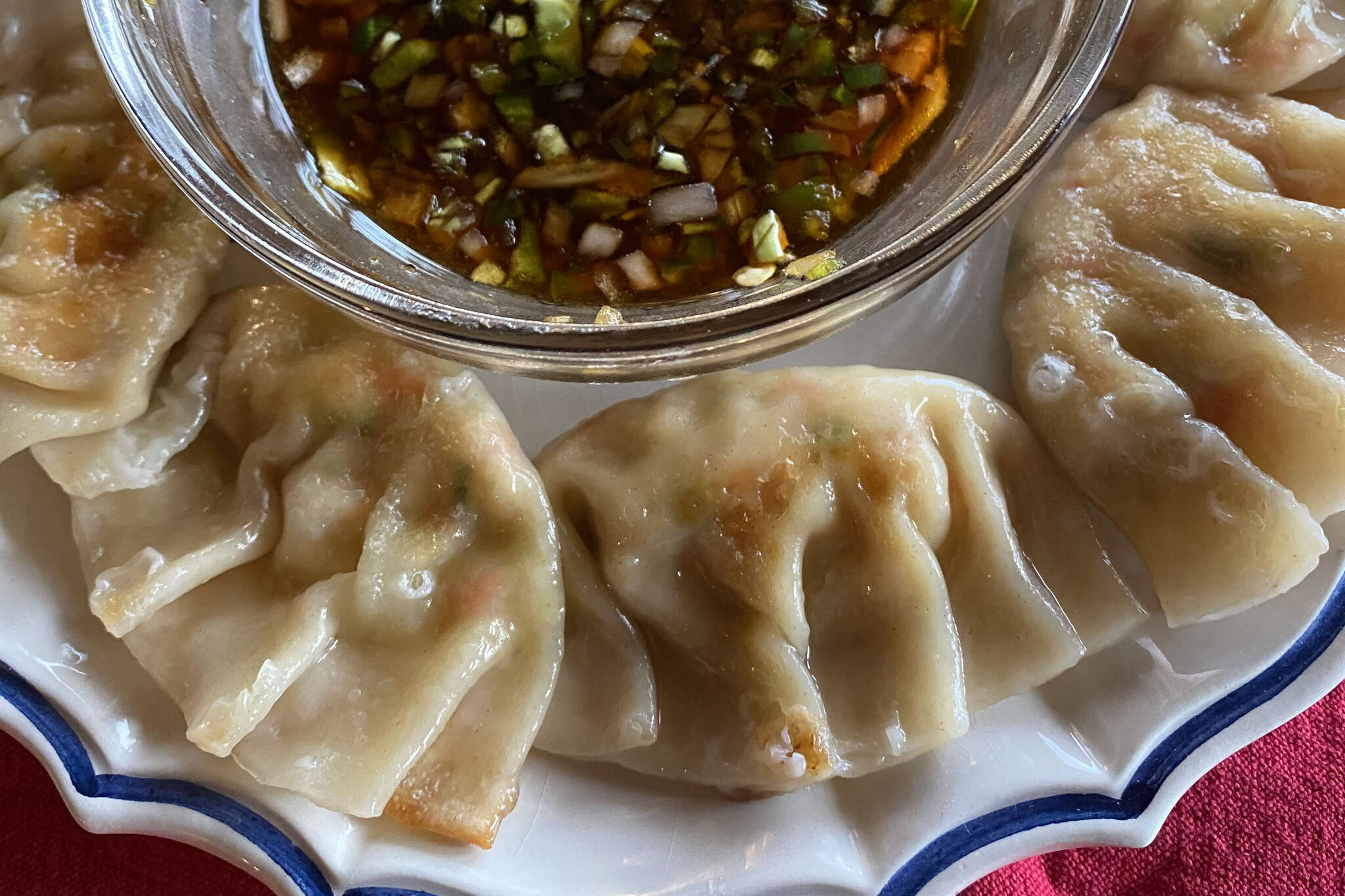 Cooked by a combination of pan frying and steaming, delicate tofu and vegetable dumplings require a delicate hand and patience. (Photo by Tressa Dale/Peninsula Clarion)