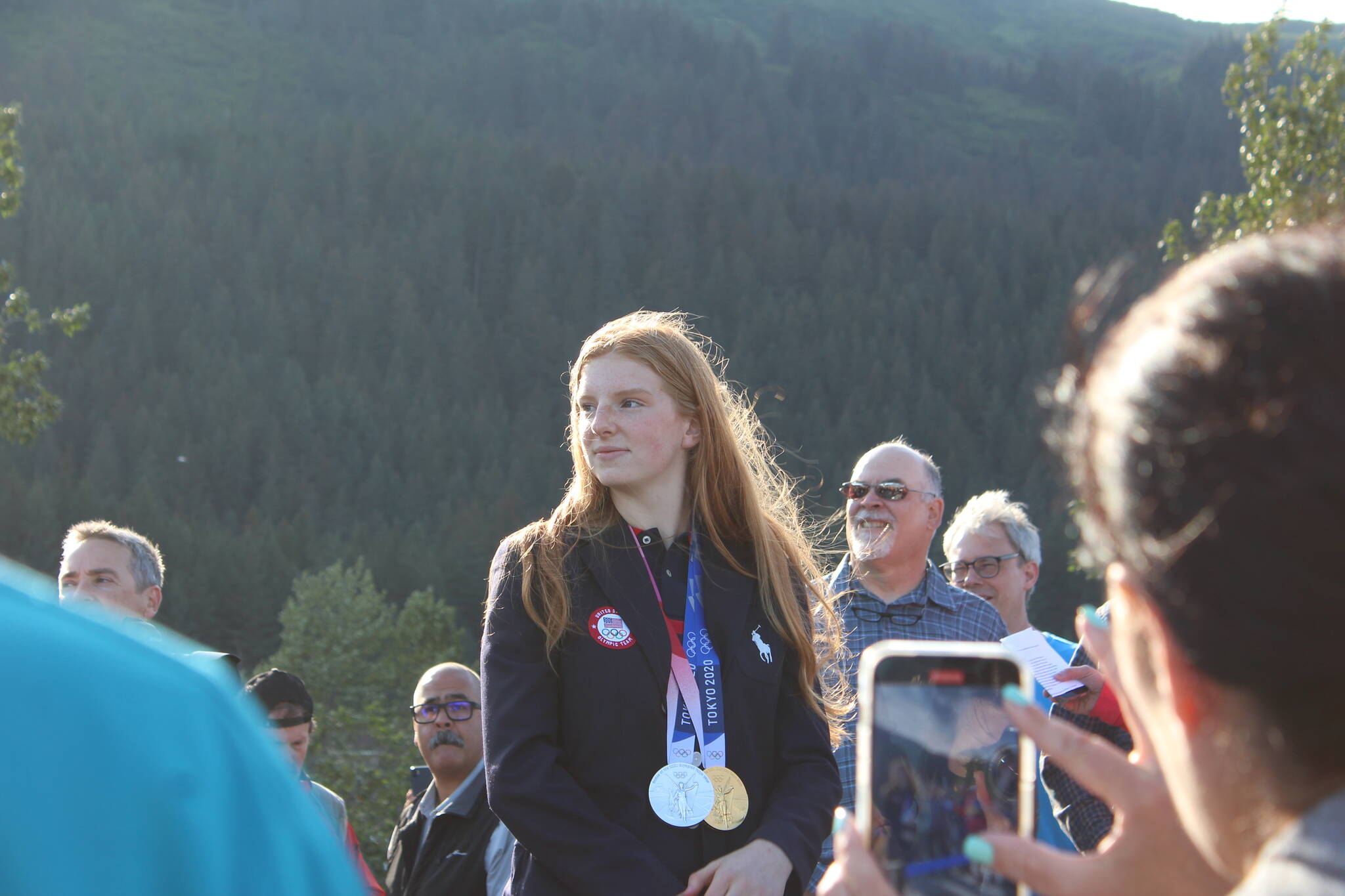 Olympic gold medalist Lydia Jacoby waves to the crowd in Seward during her celebratory parade on Thursday, Aug. 5, 2021. (Ashlyn O’Hara/Peninsula Clarion)