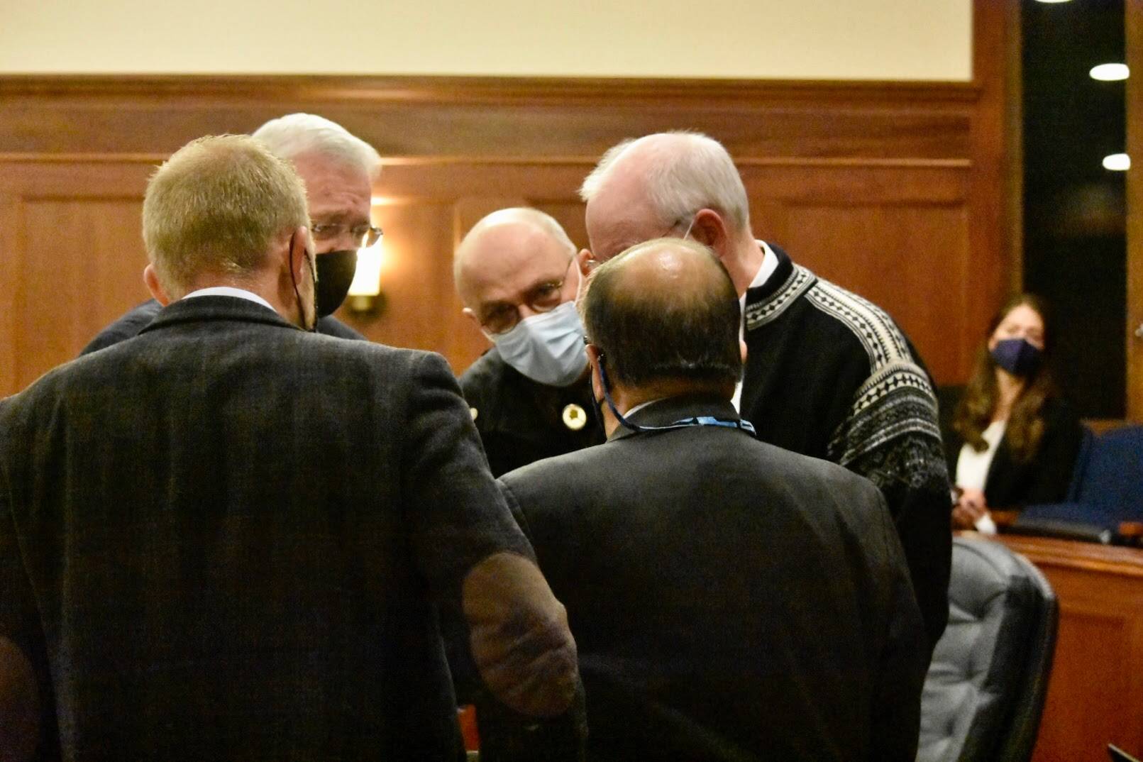 Senators converse during an At Ease in a floor session of the Alaska State Senate on Tuesday, Sept. 14, 2021. Senators passed a budget bill with a Permanent Fund Dividend of $1,100, but there’s disagreement over the fund sources that may lead to legal action. (Peter Segall / Juneau Empire)