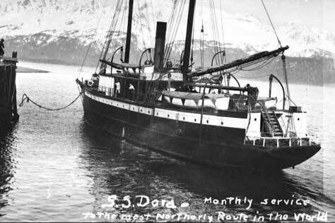 This undated photo shows the stern of the S.S. Dora near a dock on her northerly mail route. (Alaska State Library photo collection)