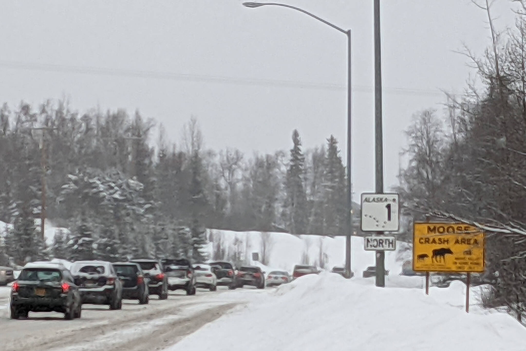 Traffic moves north along the Sterling Highway shortly after a fatal crash closed the highway for several hours Wednesday, Feb. 24, 2021. The state is seeking federal funding for a project aimed at improving safety along the Sterling Highway between mileposts 82.5 to 94, or between Sterling and Soldotna. (Photo by Erin Thompson/Peninsula Clarion)