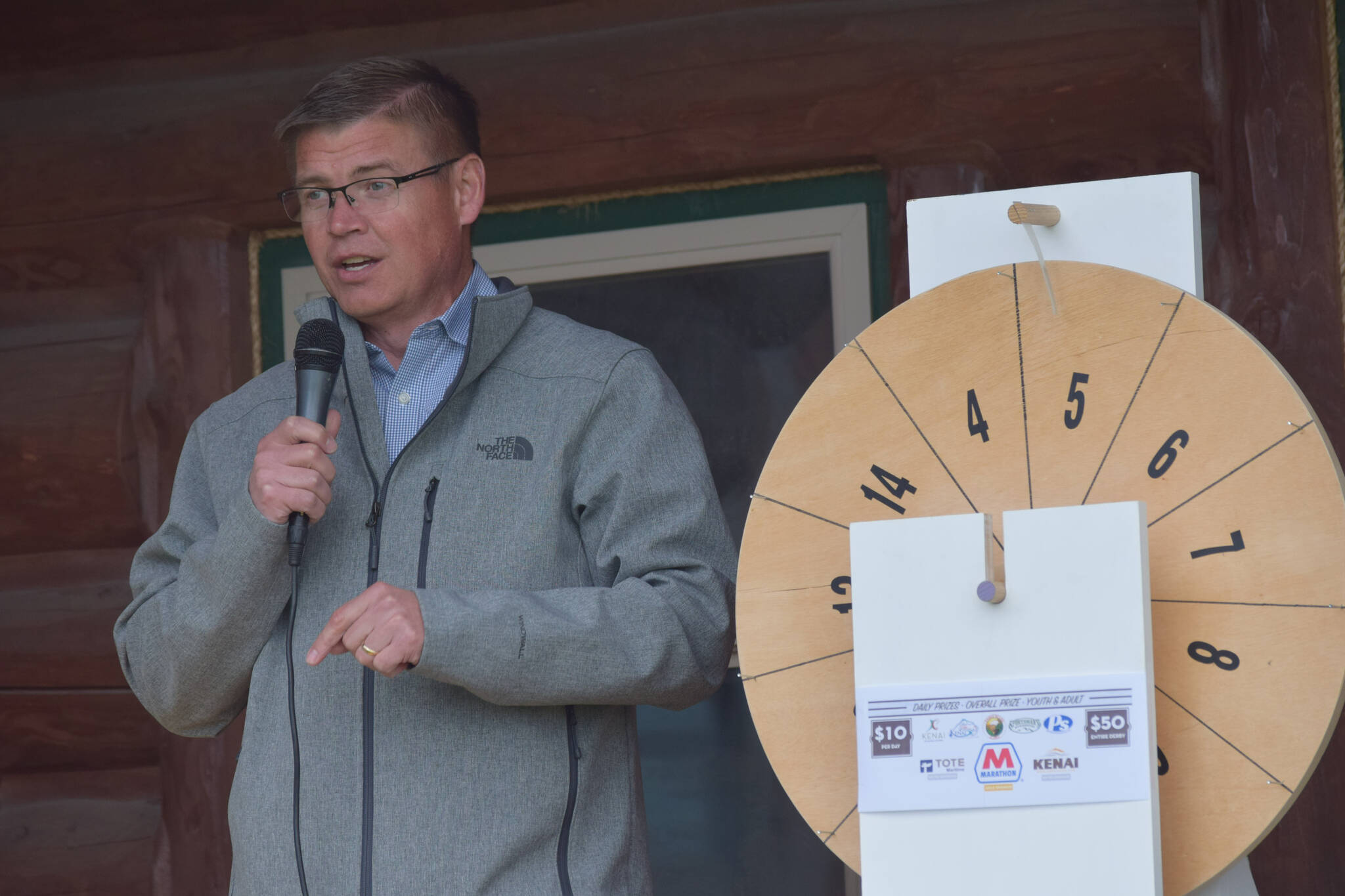 Kenai City Manager Paul Ostrander prepares to announce the winners of this year’s silver salmon derby at the Kenai Chamber of Commerce and Visitor Center on Monday, Sept. 20, 2021. (Camille Botello/Peninsula Clarion)