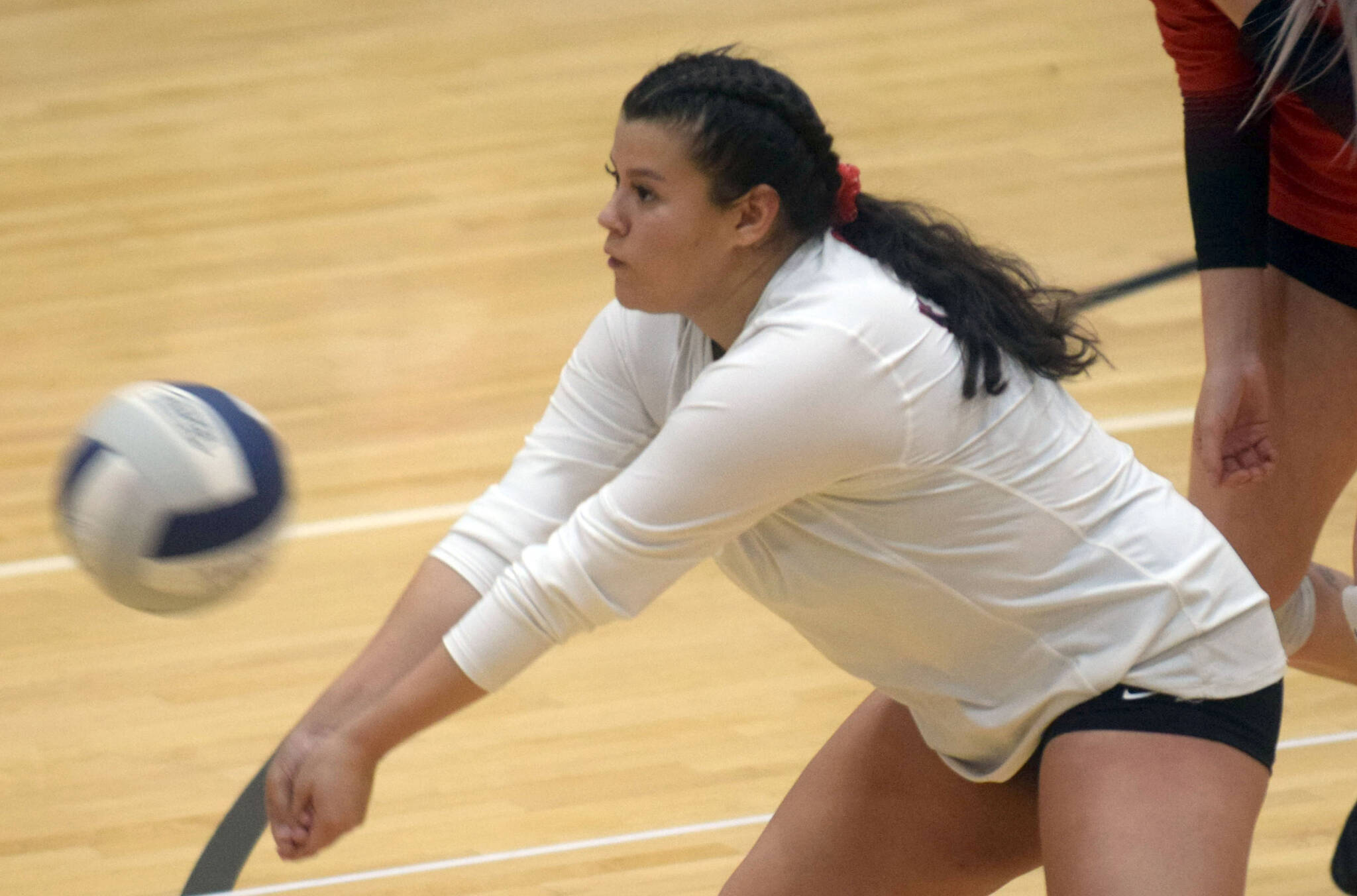 Kenai’s Valerie Villegas receives a serve during the team’s volleyball game against the Soldotna Stars on Thursday, Sept. 23, 2021, in Soldotna, Alaska. (Camille Botello/Peninsula Clarion)